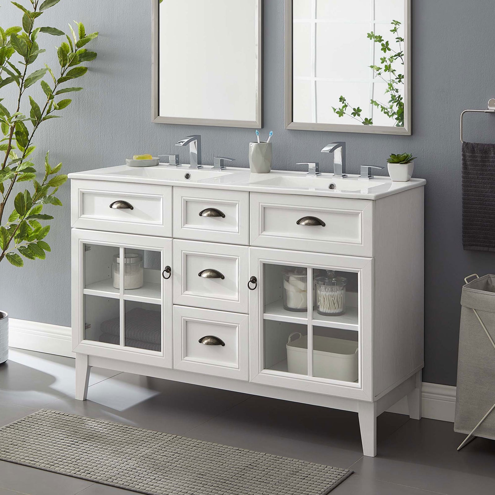 Refined double vanity anchors the bath with bright storage display and integrated twin sinks || EEI-5428-WHI-WHI || front_angle_room