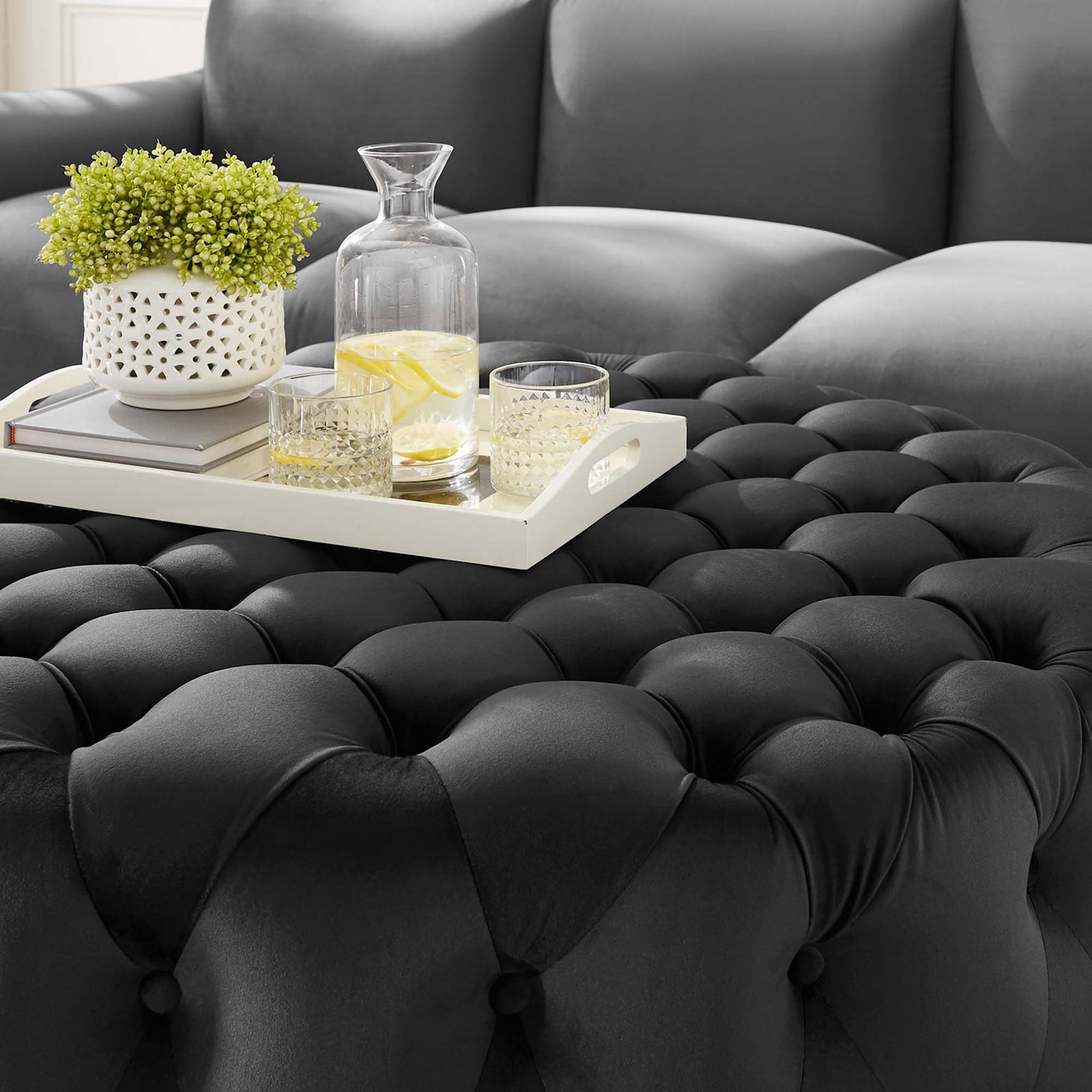 Rich tufted black velvet ottoman top styled with a tray, drinks, and decor for everyday lounging || EEI-5469-BLK || detail_room