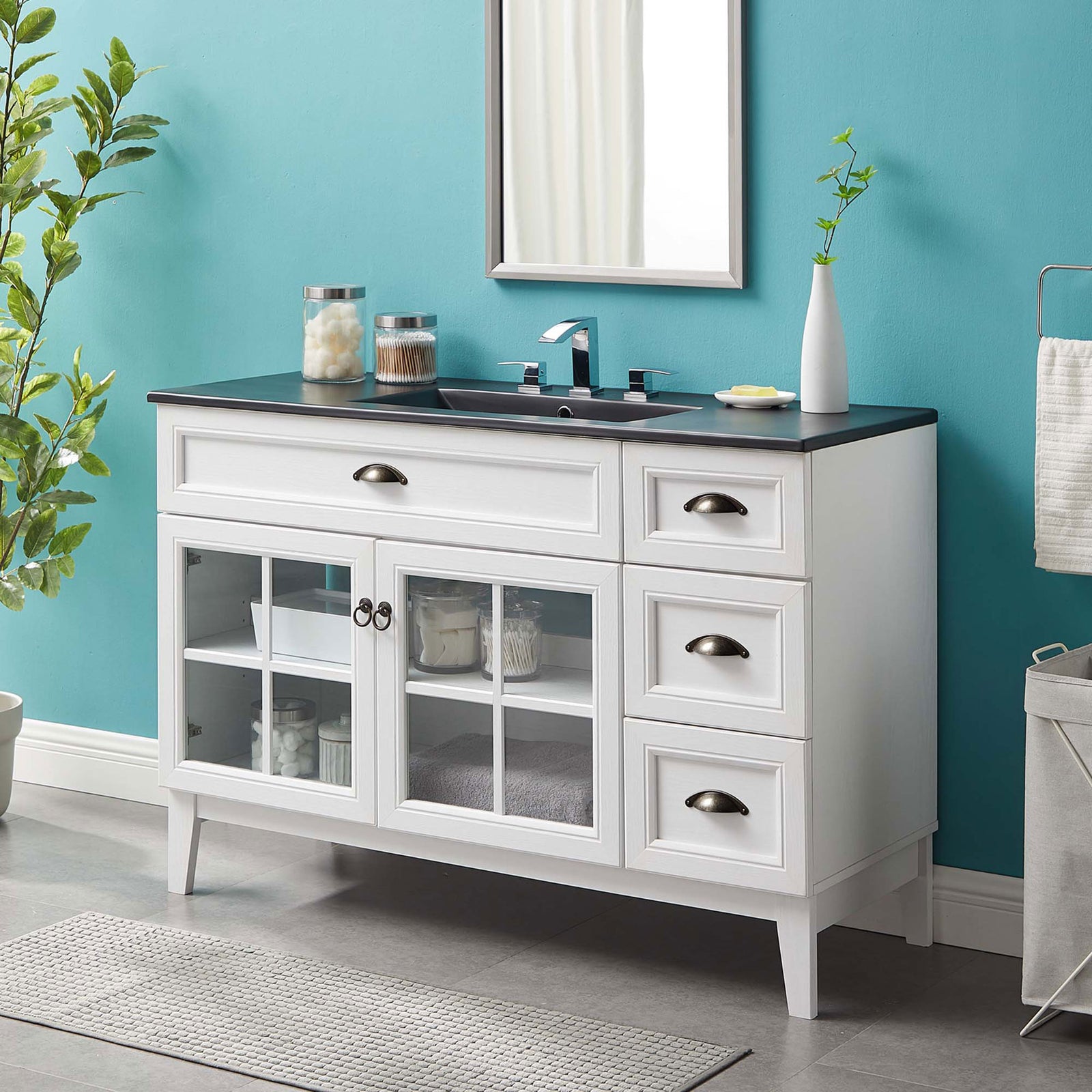 Crisp white cabinet contrasts a deep black top for a fresh, modern bath centerpiece || EEI-5479-WHI-BLK || front_angle_room
