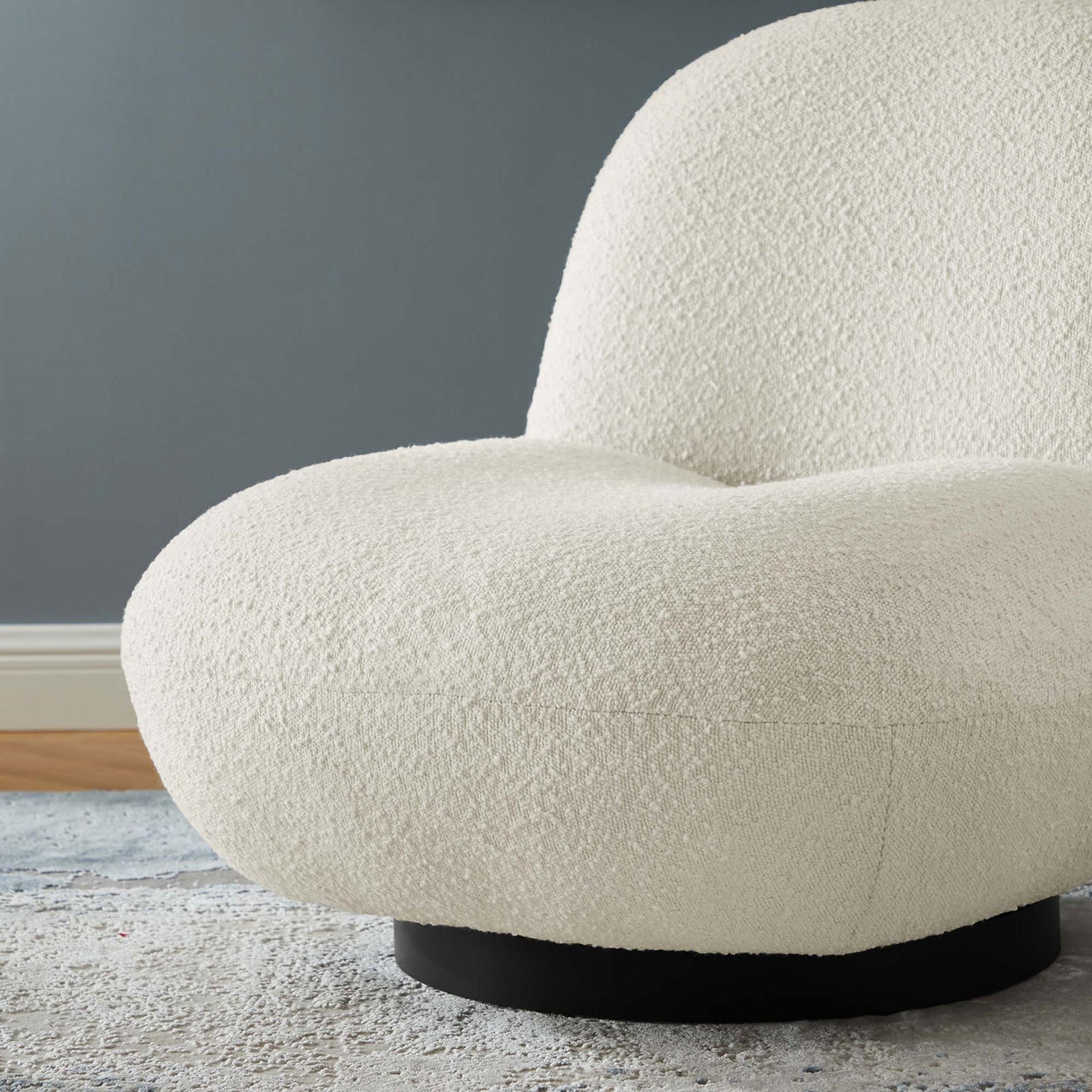 Nubby boucle fabric and slim black base deliver inviting texture and modern contrast || EEI-5486-BLK-IVO || detail_room