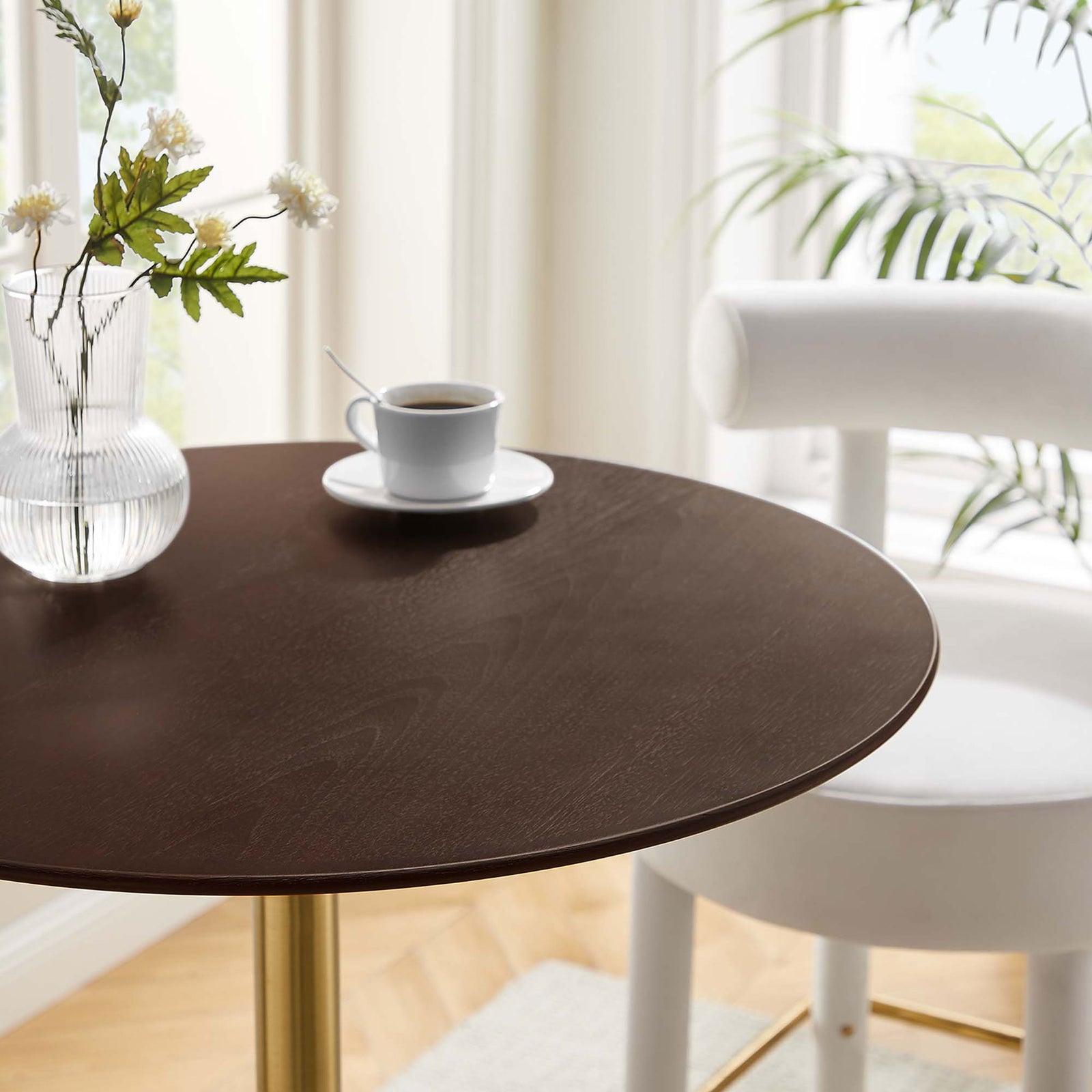 Cherry walnut tabletop with beveled edge and natural wood grain in a bright, inviting space. || EEI-5529-GLD-CHE || detail_room