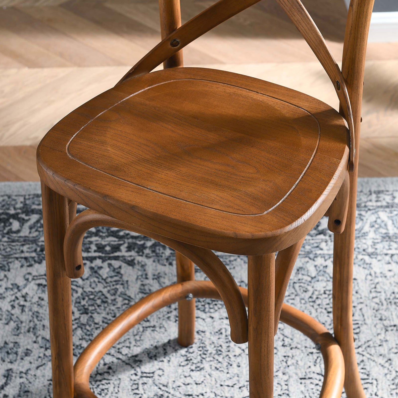 Seat detail highlights the smooth walnut finish and gently rounded edges over the arched frame || EEI-5562-WAL || detail_room