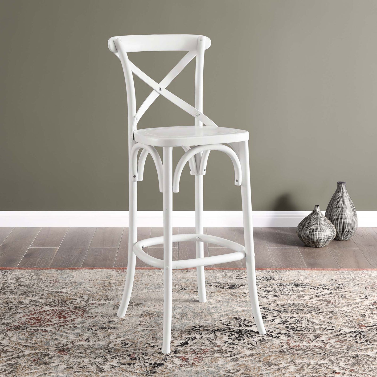 White bar stool brings fresh farmhouse style to dining areas with its X-back and curved supports || EEI-5563-WHI || front_angle_room