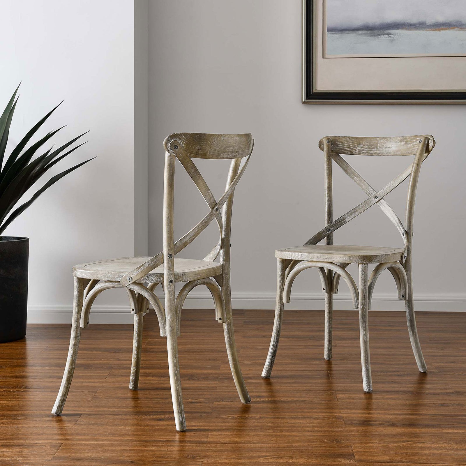 Pair of gray cross-back dining chairs in a modern room setting for casual kitchen or dining spaces || EEI-5564-GRY || front_angle_room