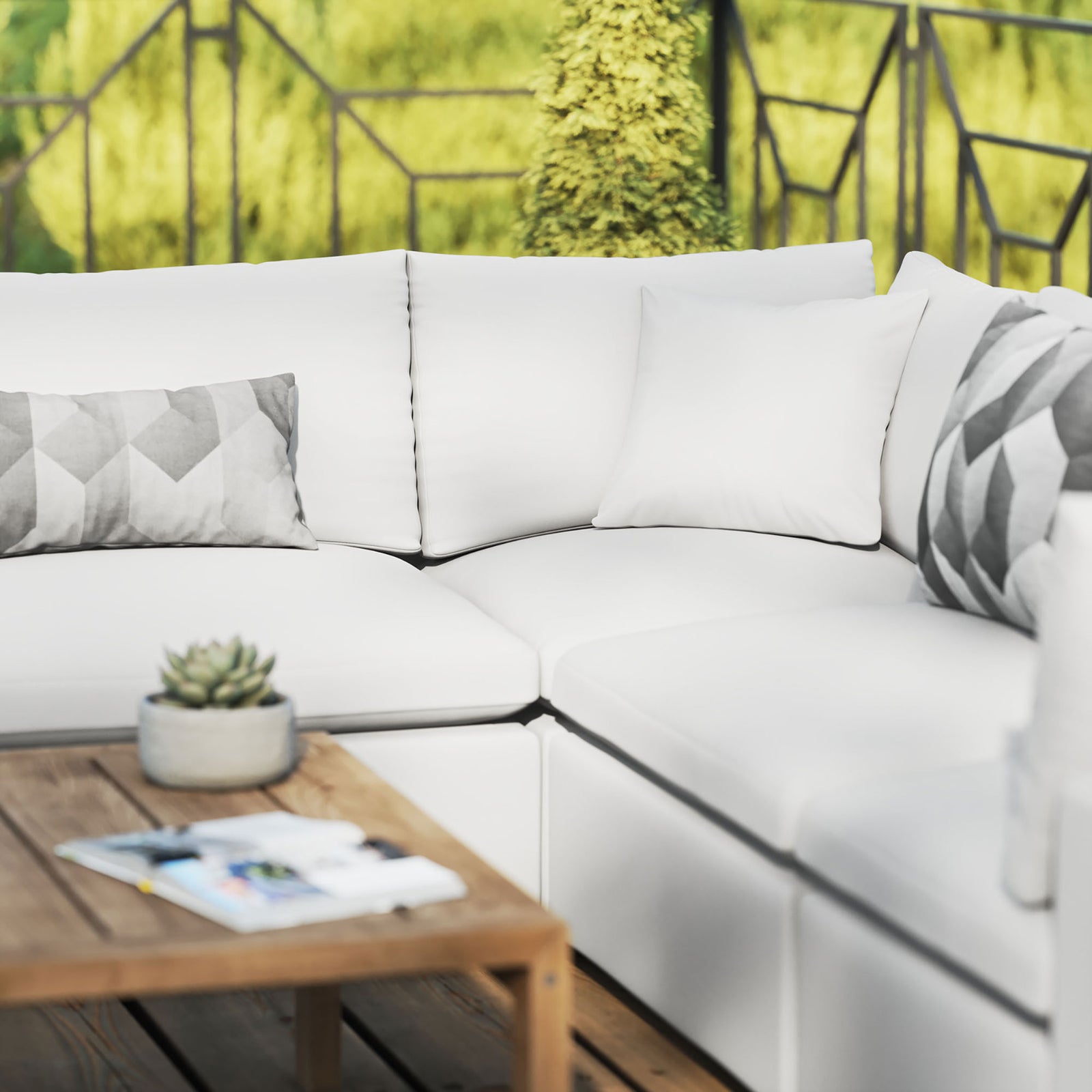White Commix sectional on a sunlit deck styled with geometric accent pillows and a natural wood coffee table. || EEI-5589-WHI || detail_room