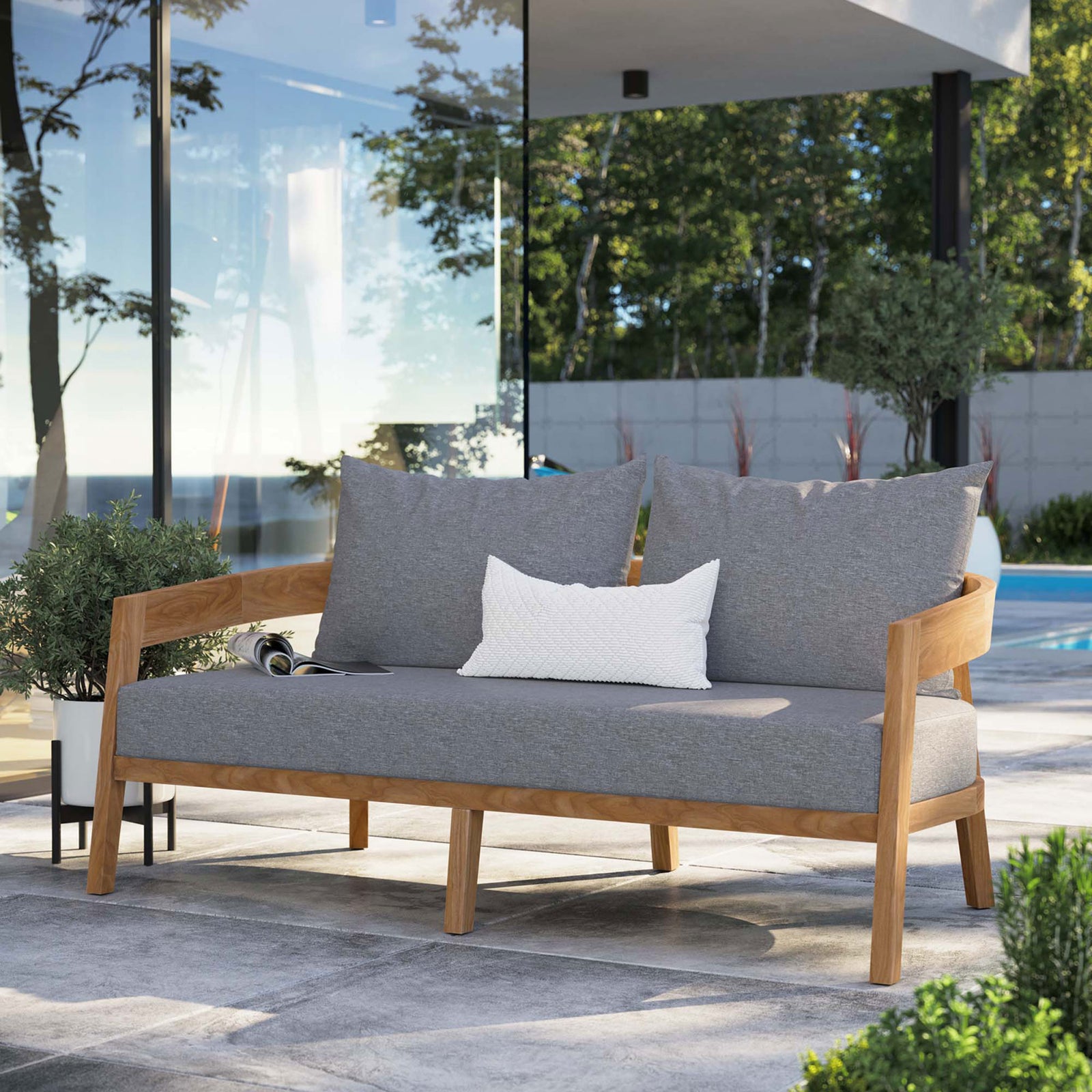 Gray cushioned teak loveseat creates a cozy gathering spot beside the pool on a modern patio || EEI-5601-NAT-GRY || front_angle_room