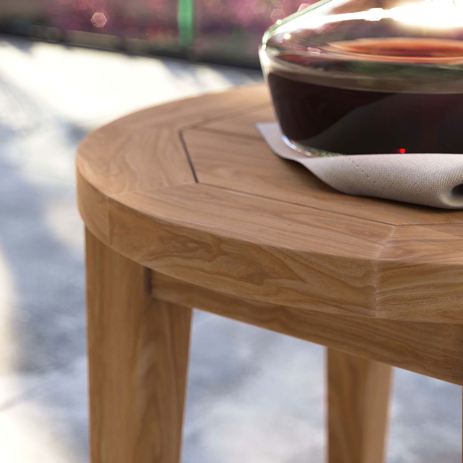 Teak side table edge and wood grain bring natural warmth to an outdoor entertaining space || EEI-5604-NAT || swatch_room