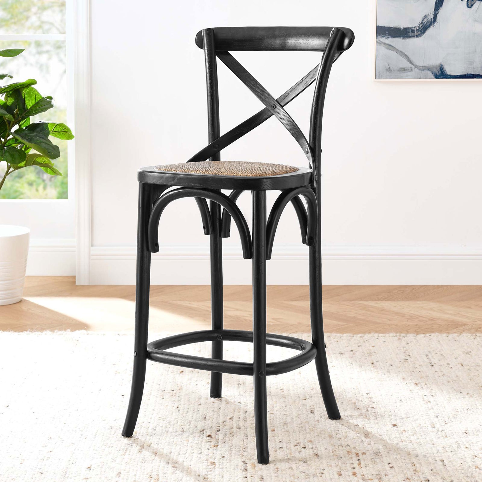 Counter stool elevates the kitchen with an X-brace back, rattan seat, and arched accents. || EEI-5667-BLK || front_angle_room