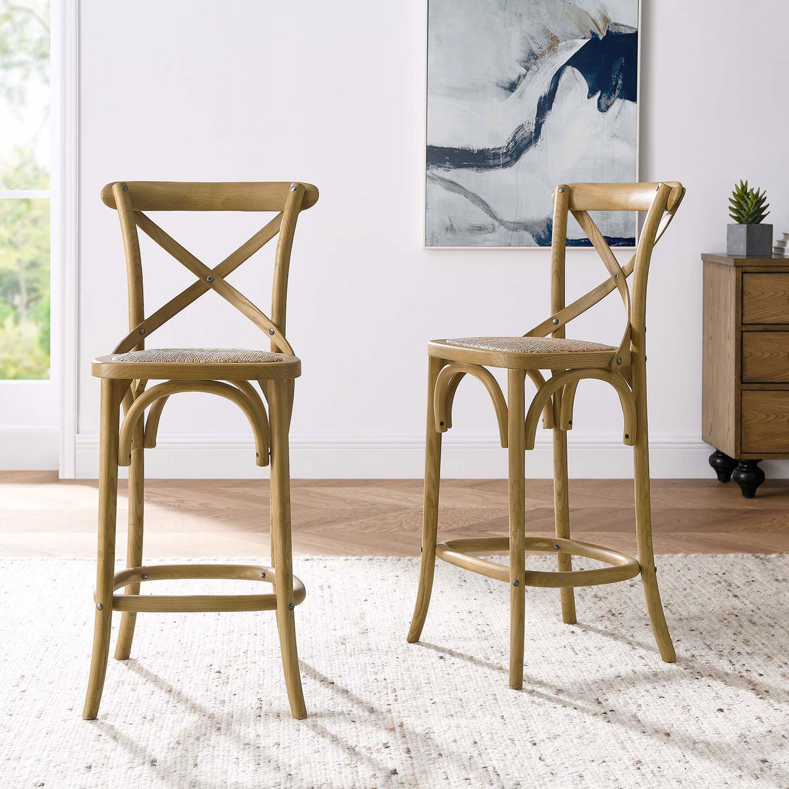 Cross-back counter stool elevates casual dining with warm wood tones and airy rattan. || EEI-5667-NAT || front_angle_room