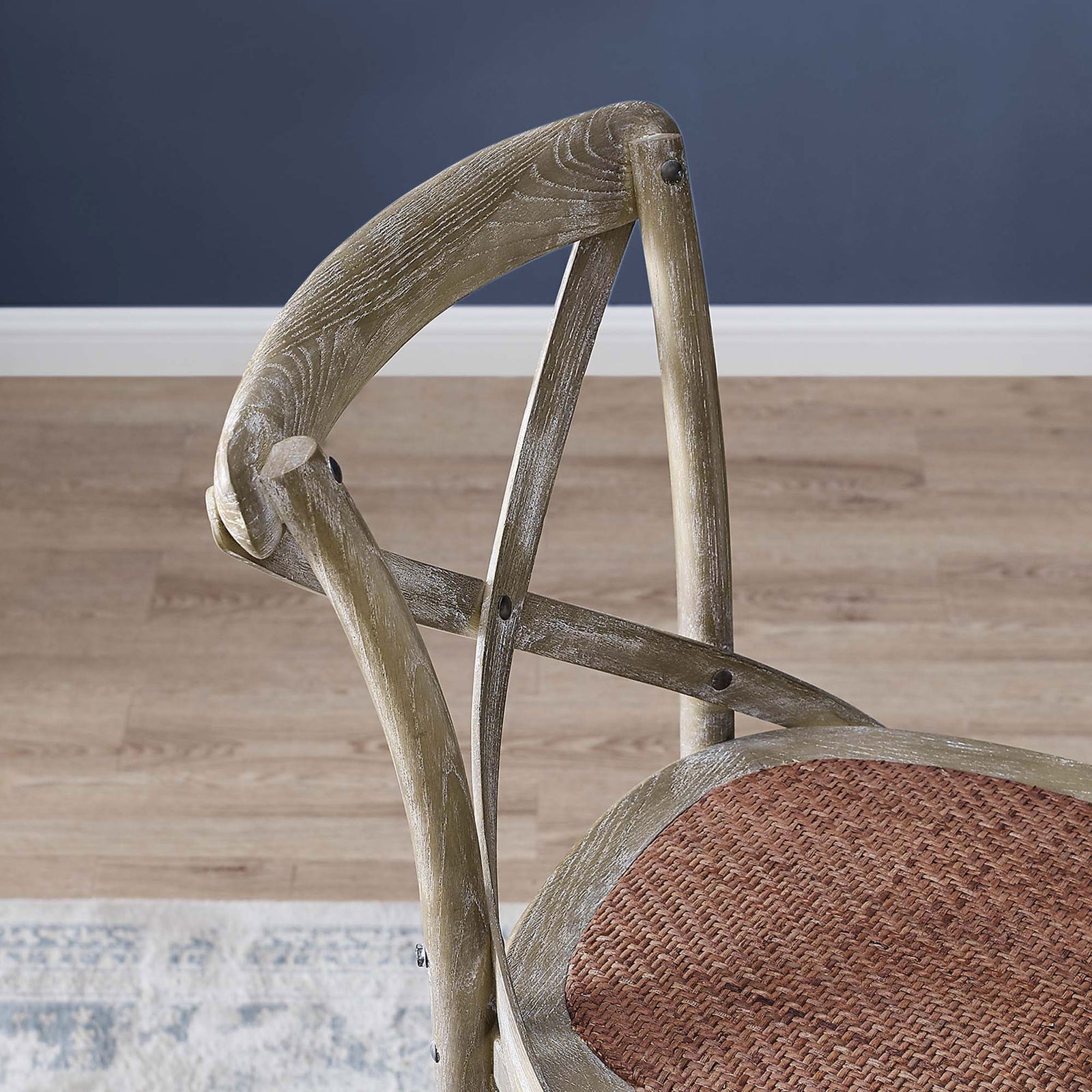 Close look at the sculpted cross-back and grain detail in the weathered gray elm frame || EEI-5668-GRY || detail_room