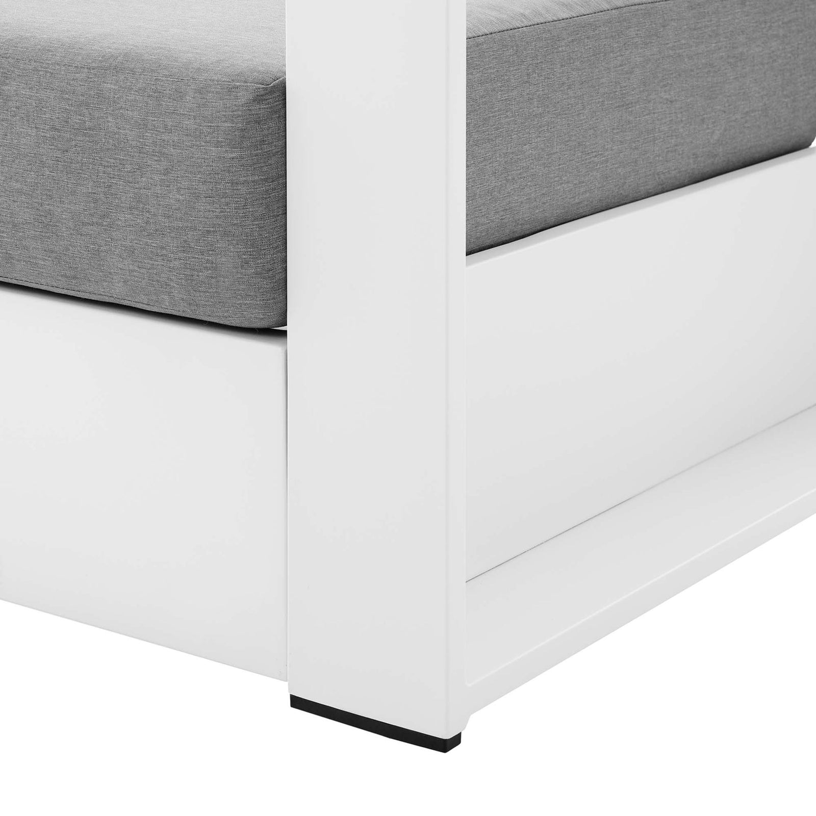 Detail of Tahoe armchair leg showing smooth white aluminum base with protective foot glides || EEI-5675-WHI-GRY || leg_studio