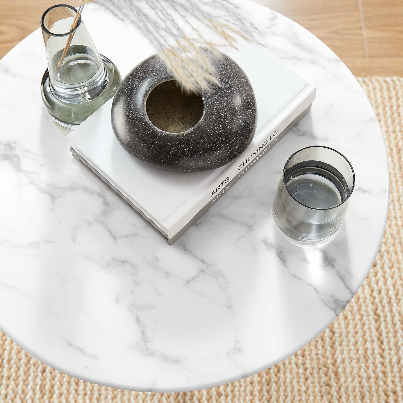 Round faux marble tabletop styled with decor in a bright living room setting || EEI-5680-WHI-WHI || detail_room