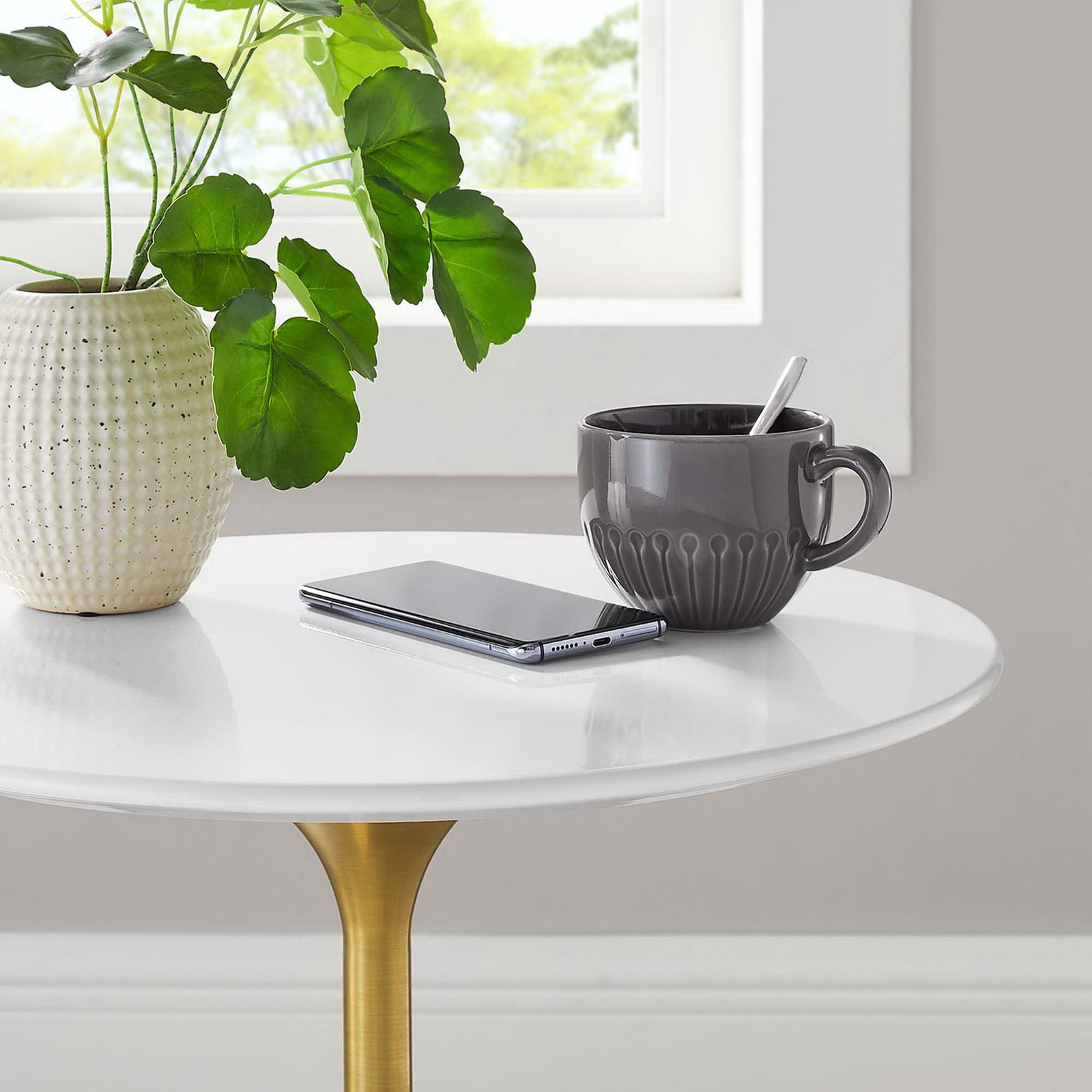 White tabletop provides a bright perch for plants, mugs, and devices beside a sunny window || EEI-5683-GLD-WHI || detail_room