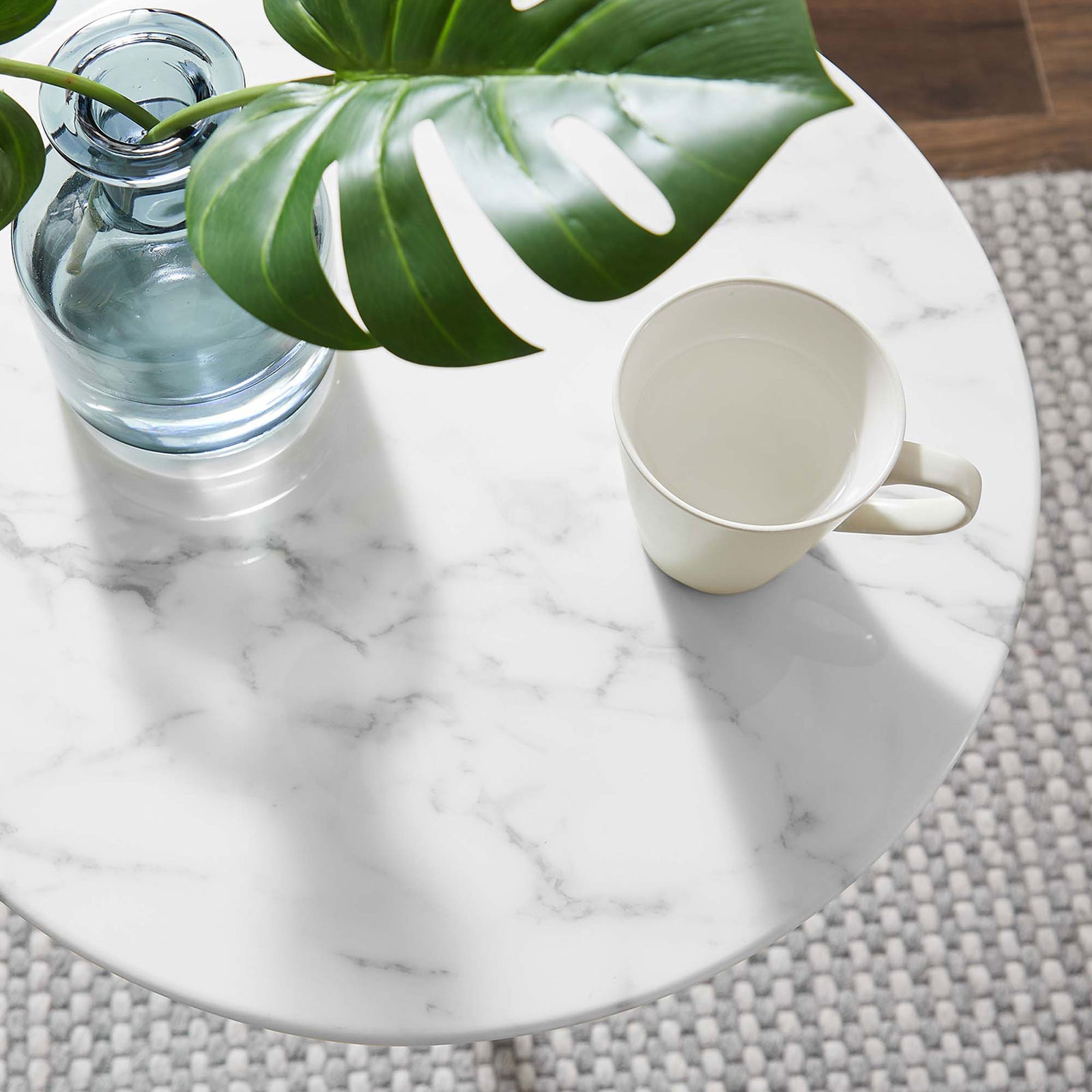 Faux marble tabletop styled with greenery, a glass vase, and mug to showcase the table's smooth easy-clean surface || EEI-5685-GLD-WHI || detail_room