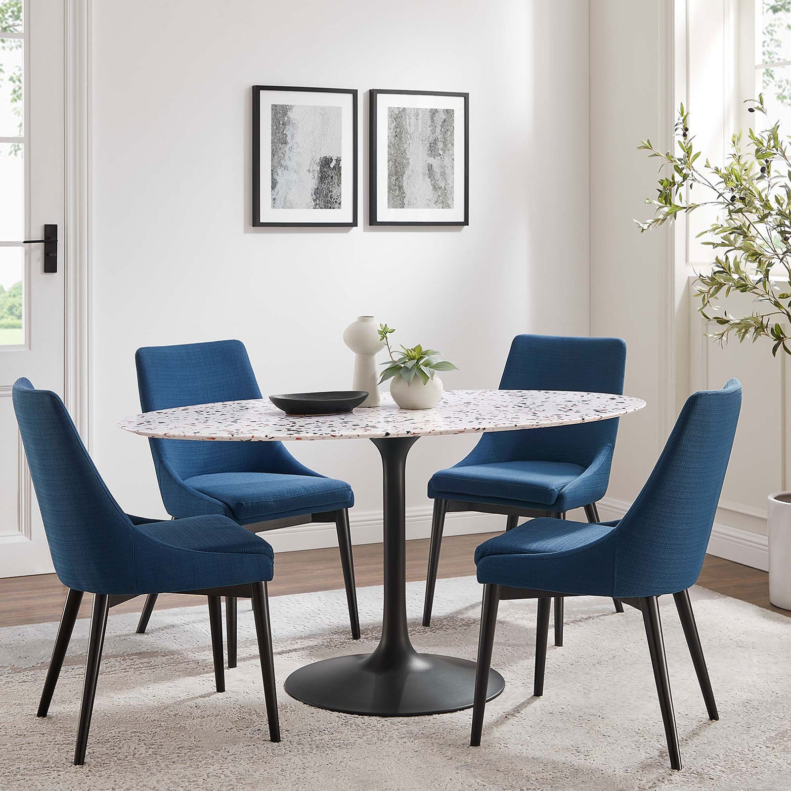 Terrazzo dining table pairs effortlessly with upholstered chairs to create a fresh, modern gathering space || EEI-5737-BLK-WHI || front_angle_room