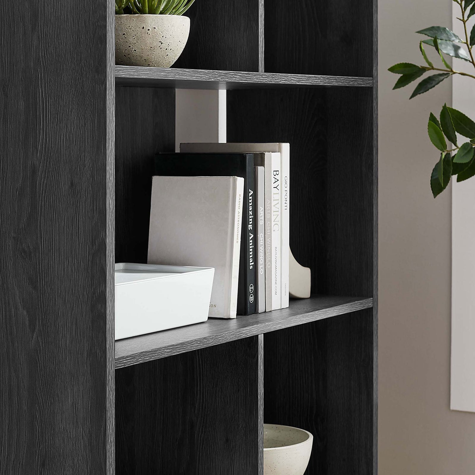 Styled shelves showcase books and decor with a sleek charcoal finish and clean lines. || EEI-5743-CHA || detail_room