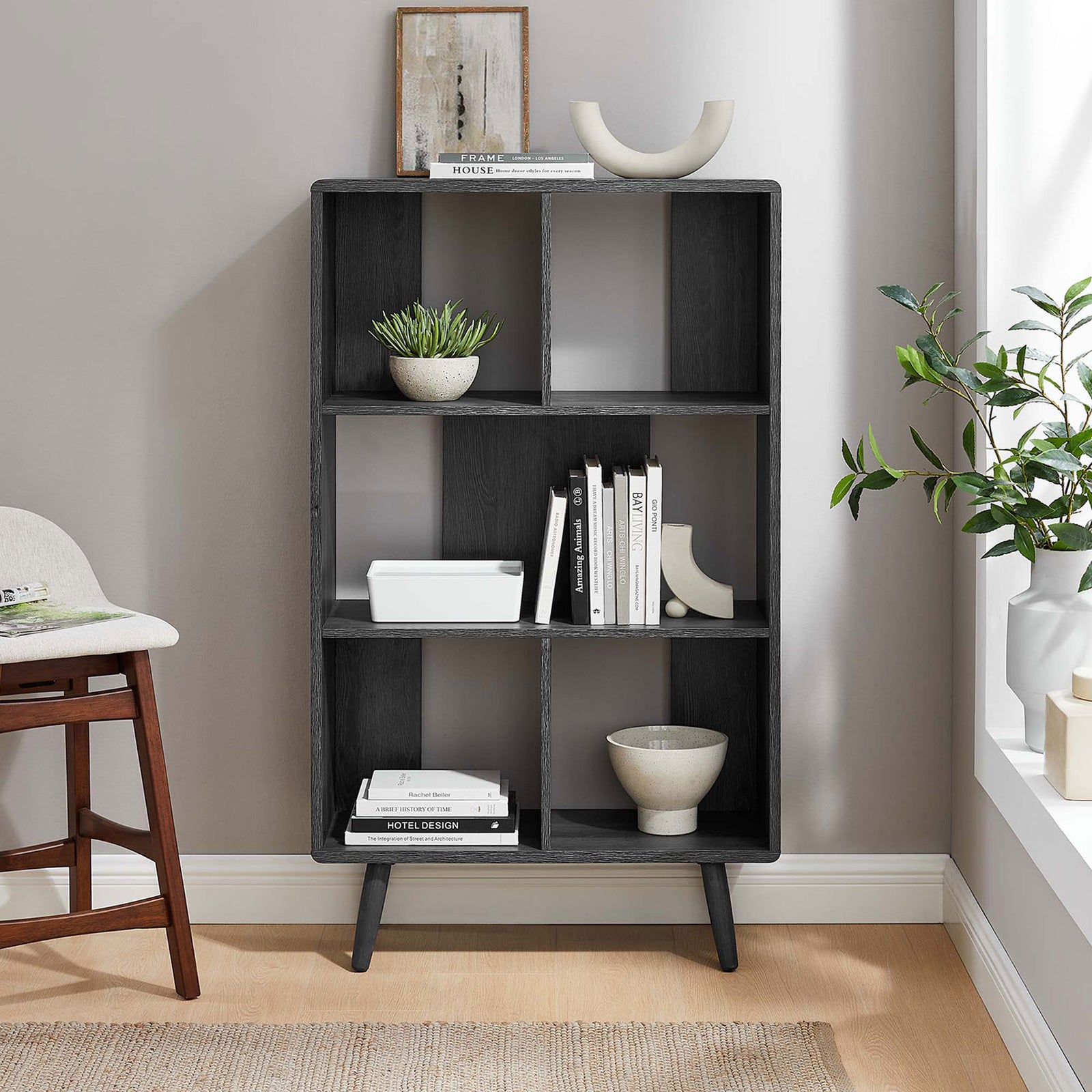 Charcoal bookcase elevates a modern room with five open shelves for books and curated accents. || EEI-5743-CHA || front_room