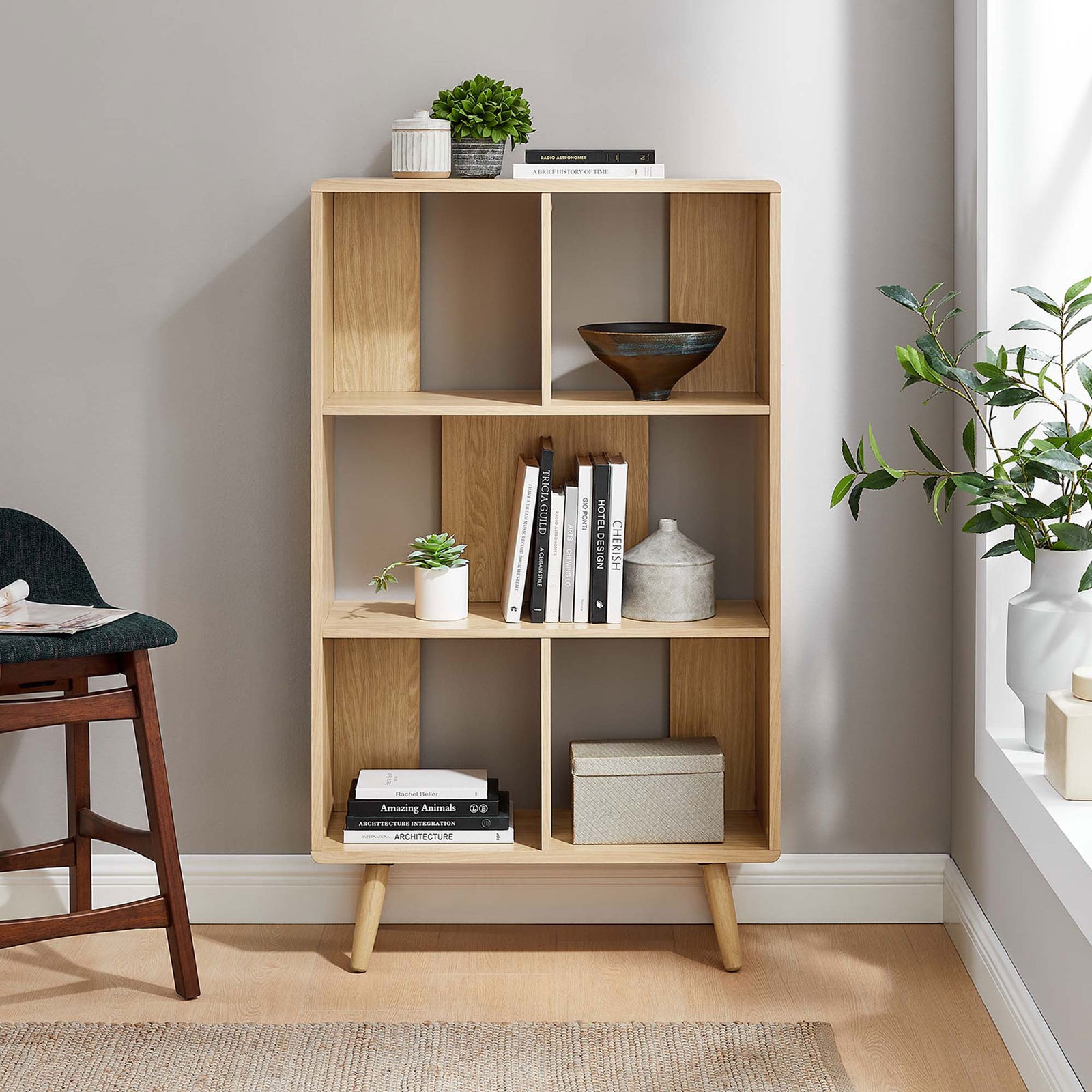 Oak bookcase styled in a bright living space for books, accents, and collectibles || EEI-5743-OAK || front_room