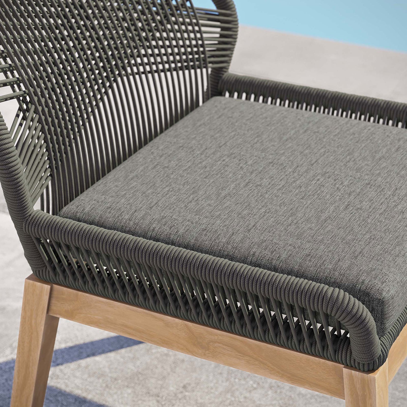 Woven gray rope frame and smooth graphite cushion surface emphasize the texture and quality of this chair || EEI-5747-GRY-GPH || detail_room