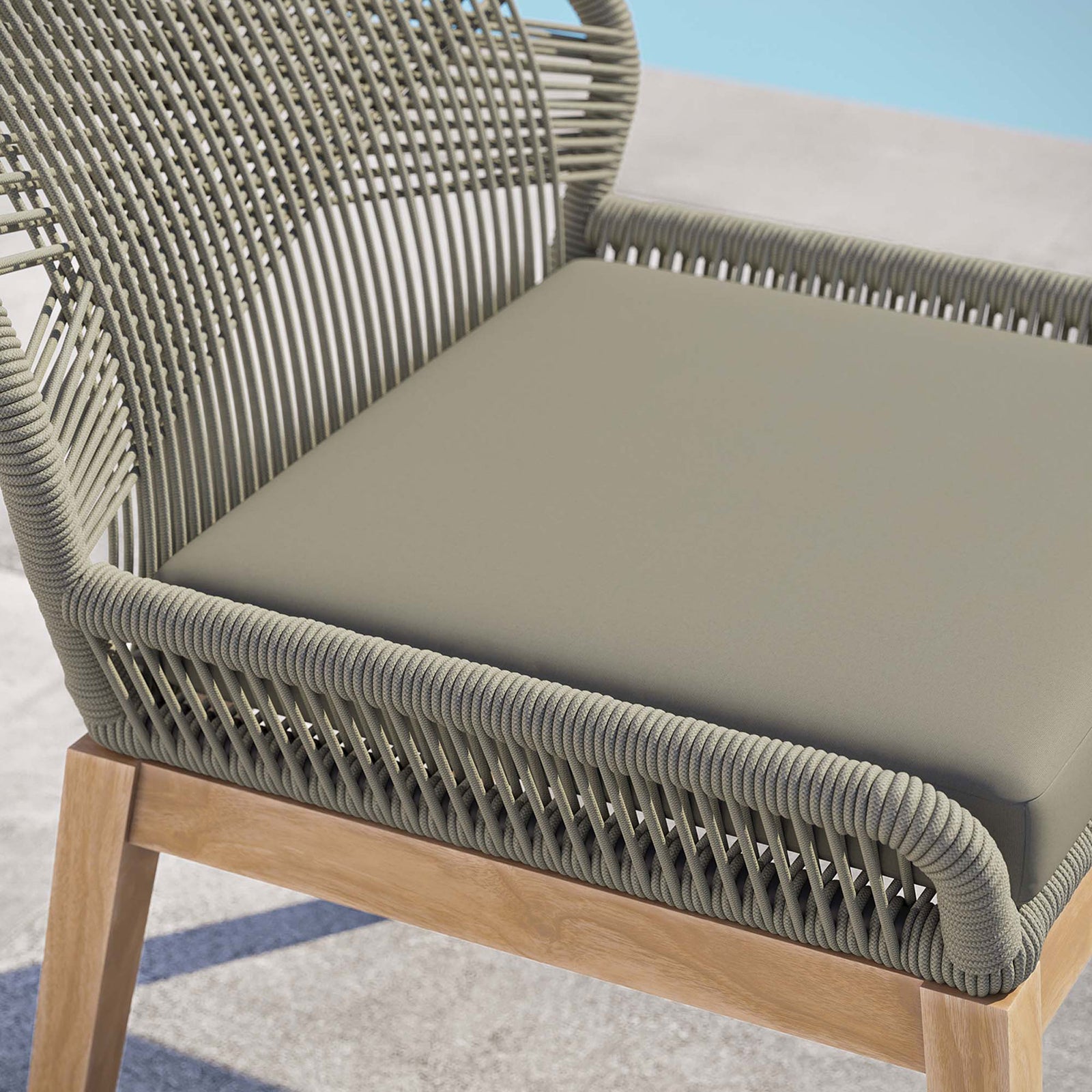 Smooth light gray greige cushion and tightly wrapped rope seat highlight the comfort and detailing of this chair || EEI-5747-LGR-GRG || detail_room