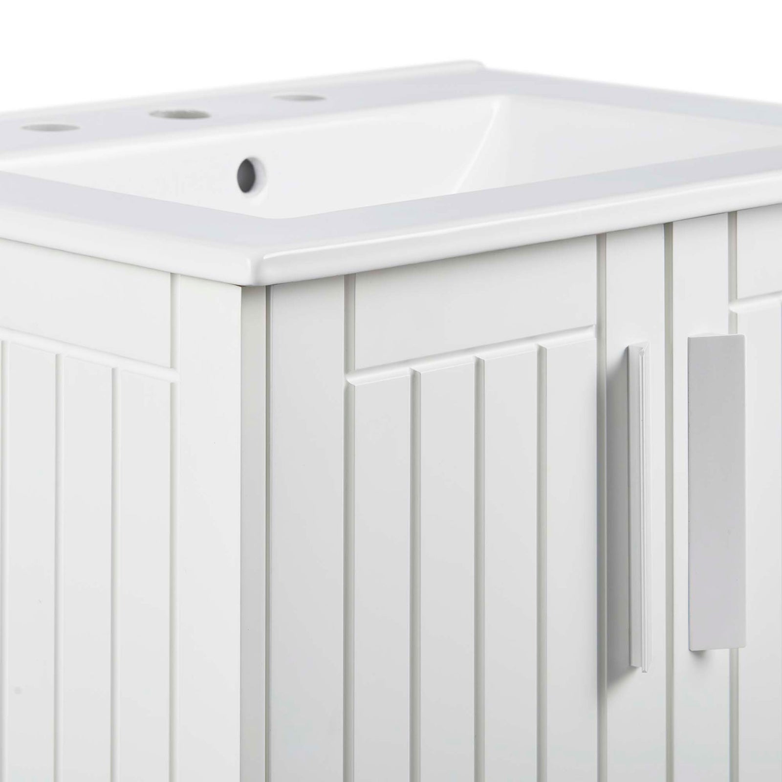 Textured paneling and streamlined rectangular door handle on the white vanity || EEI-5800-WHI-WHI || detail_studio