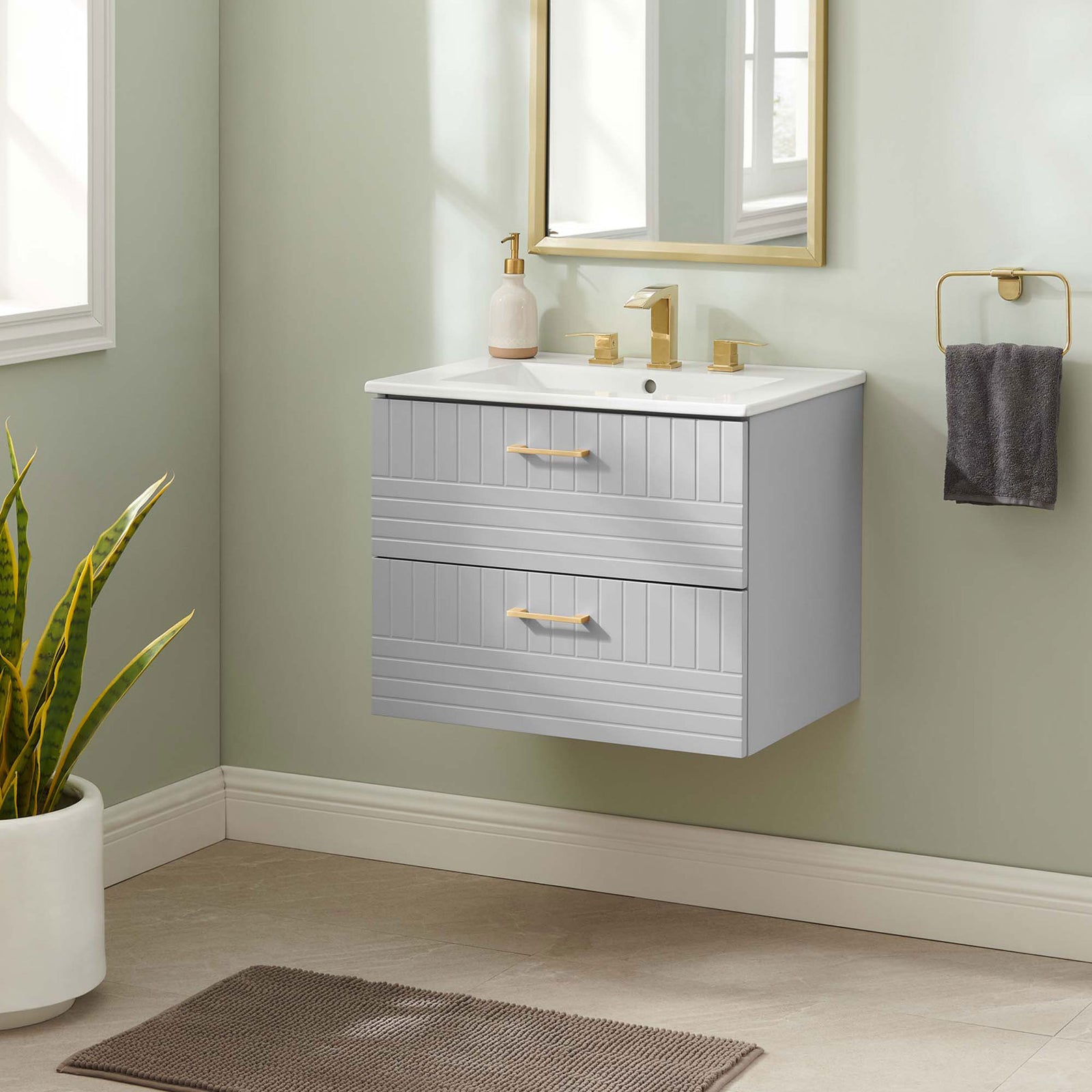 Wall-mounted design frees floor space and brightens the bath with light gray and gold accents || EEI-5818-LGR-WHI || front_room