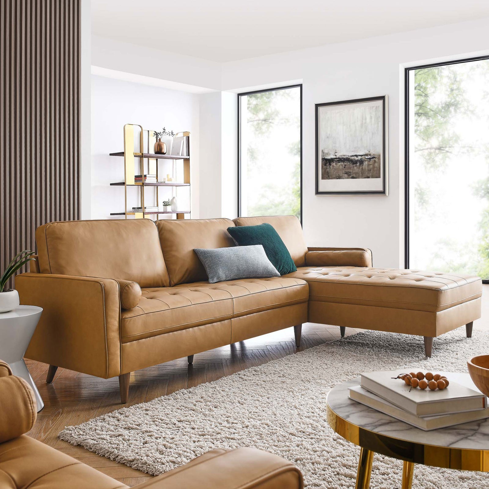 Tan leather sectional with right chaise styled in a bright living room with textured rug and modern accents. || EEI-5873-TAN || front_angle_room