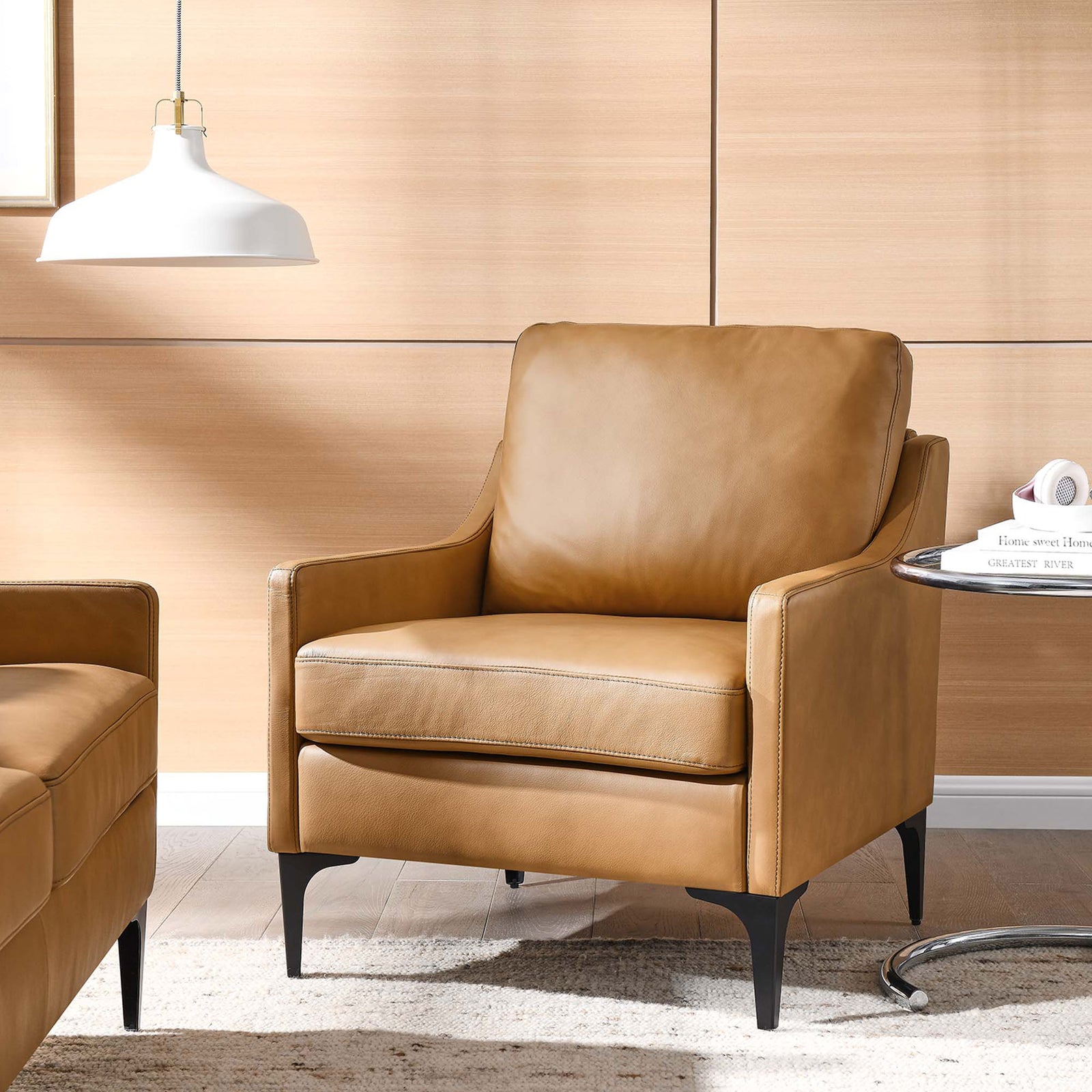 Cozy tan leather armchair elevates the living room with modern lines and slender black legs || EEI-6022-TAN || front_angle_room