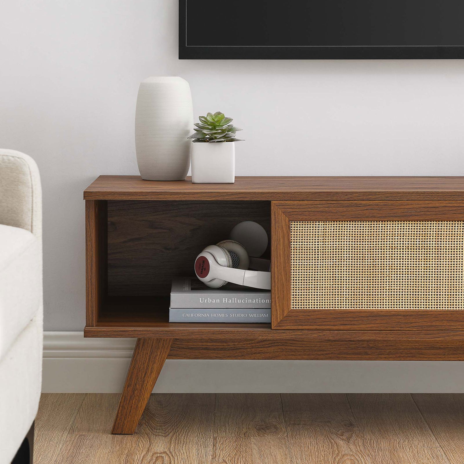 Walnut tv stand with open storage cubby styled with books and headphones || EEI-6039-WAL || storage_room