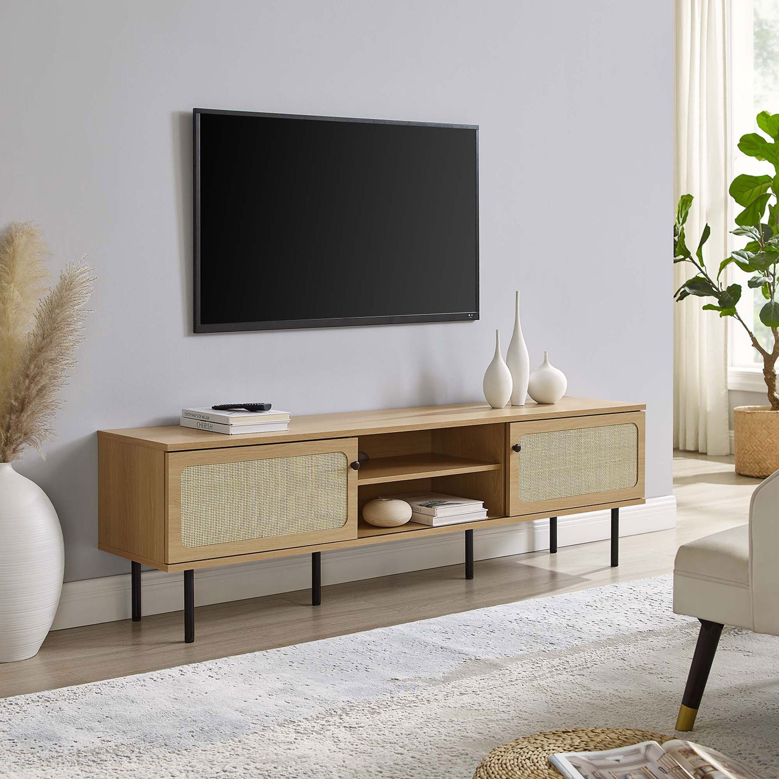 Extra-long oak TV console with dual rattan doors and black legs completing a spacious living area. || EEI-6046-OAK || front_angle_room