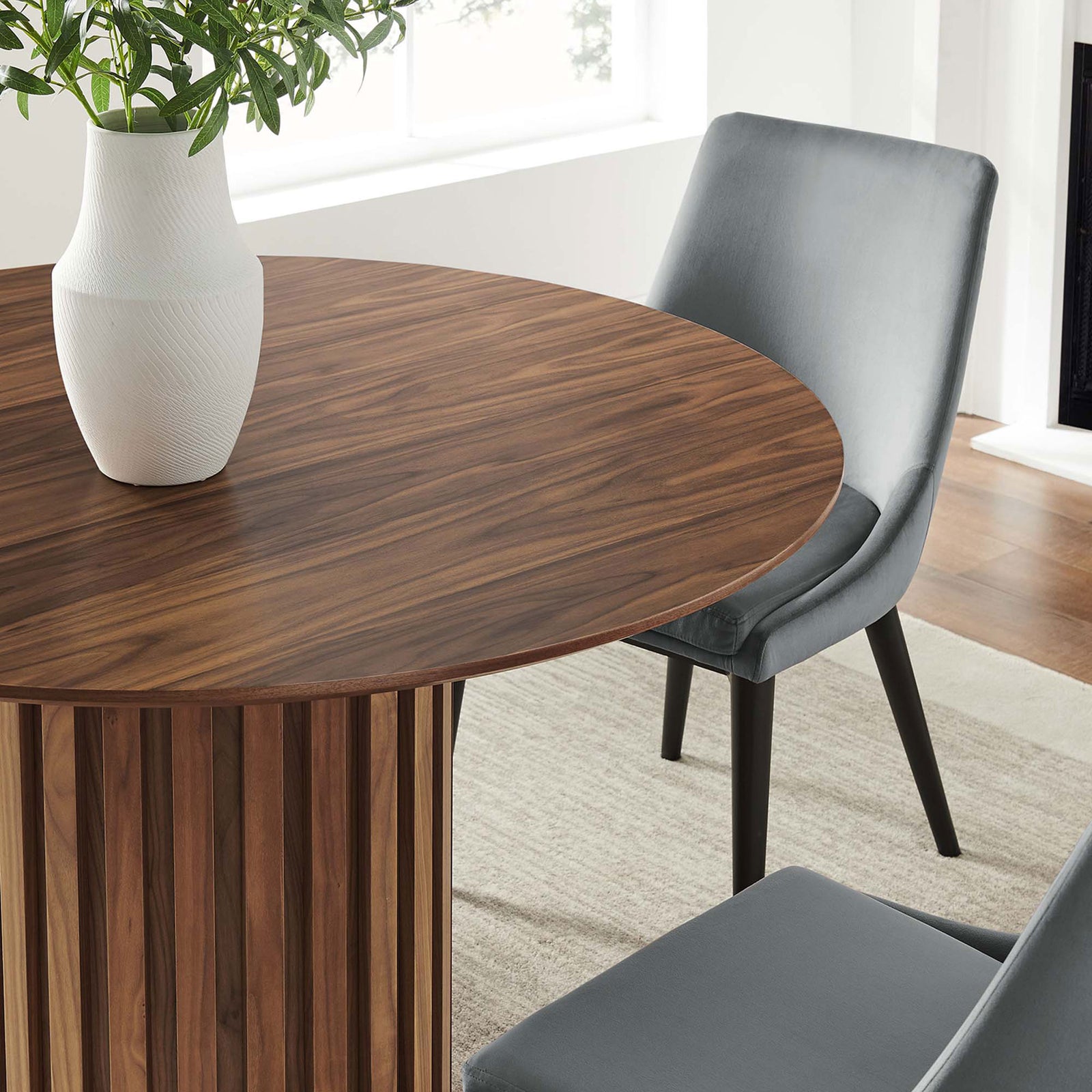 Styled tabletop vignette highlights the walnut finish and pairs beautifully with modern upholstered chairs || EEI-6064-WAL-SET || detail_room