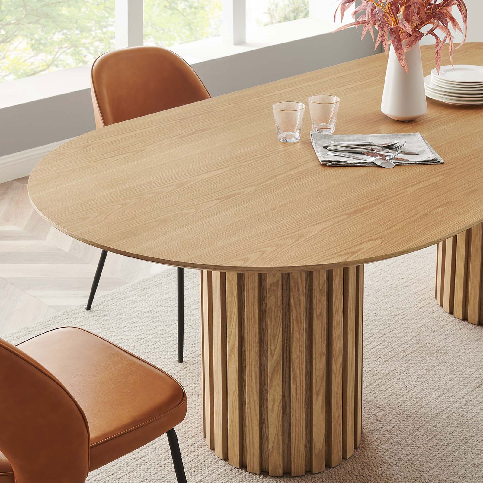 Senja oak dining table styled with camel dining chairs, glassware, and a simple white vase arrangement || EEI-6065-OAK-SET || detail_room