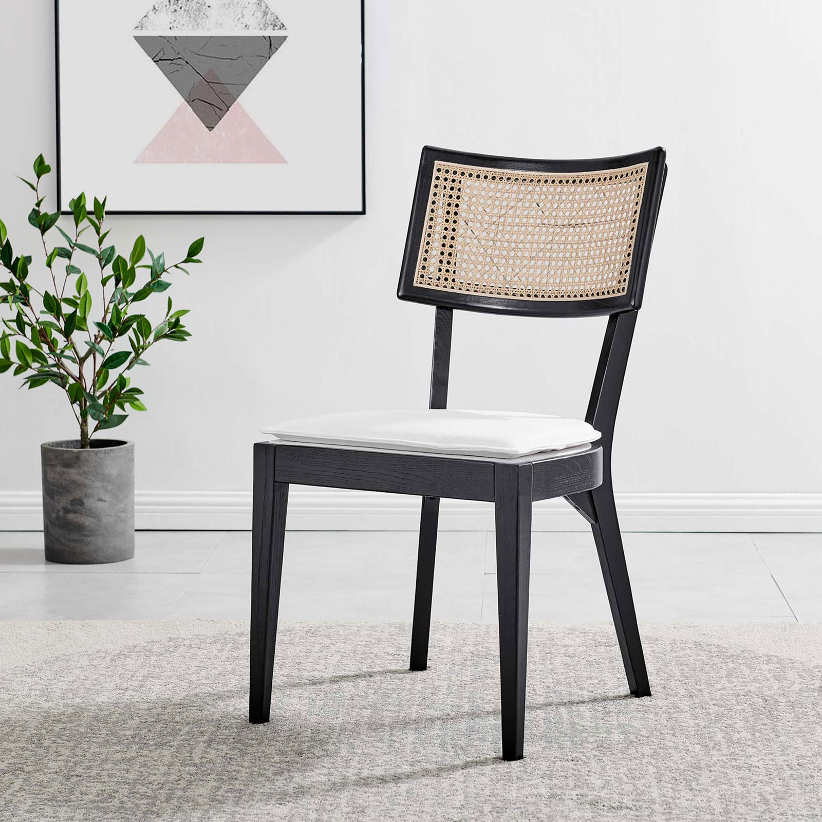 Black wood dining chair with rattan back and white seat set in a modern living space || EEI-6080-BLK-WHI || front_angle_room