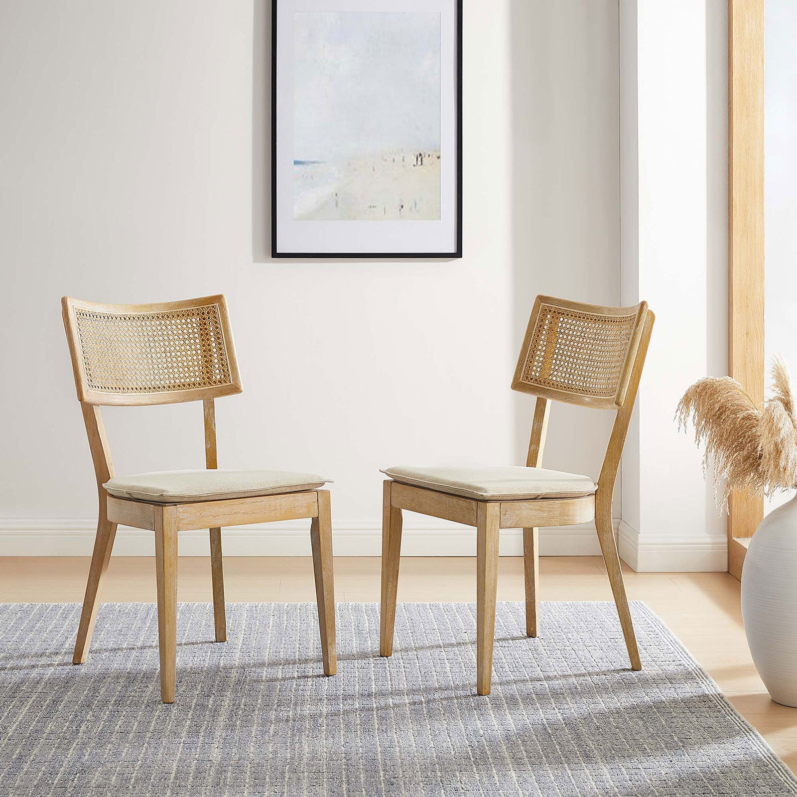 Pair of rattan back dining chairs styled in a cozy neutral dining room with soft natural light || EEI-6080-GRY-BEI || front_angle_multi_room