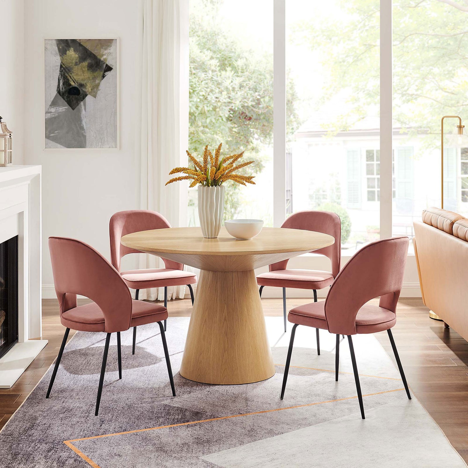 Round oak pedestal dining table seats four comfortably and anchors a bright contemporary dining space || EEI-6102-OAK || front_room