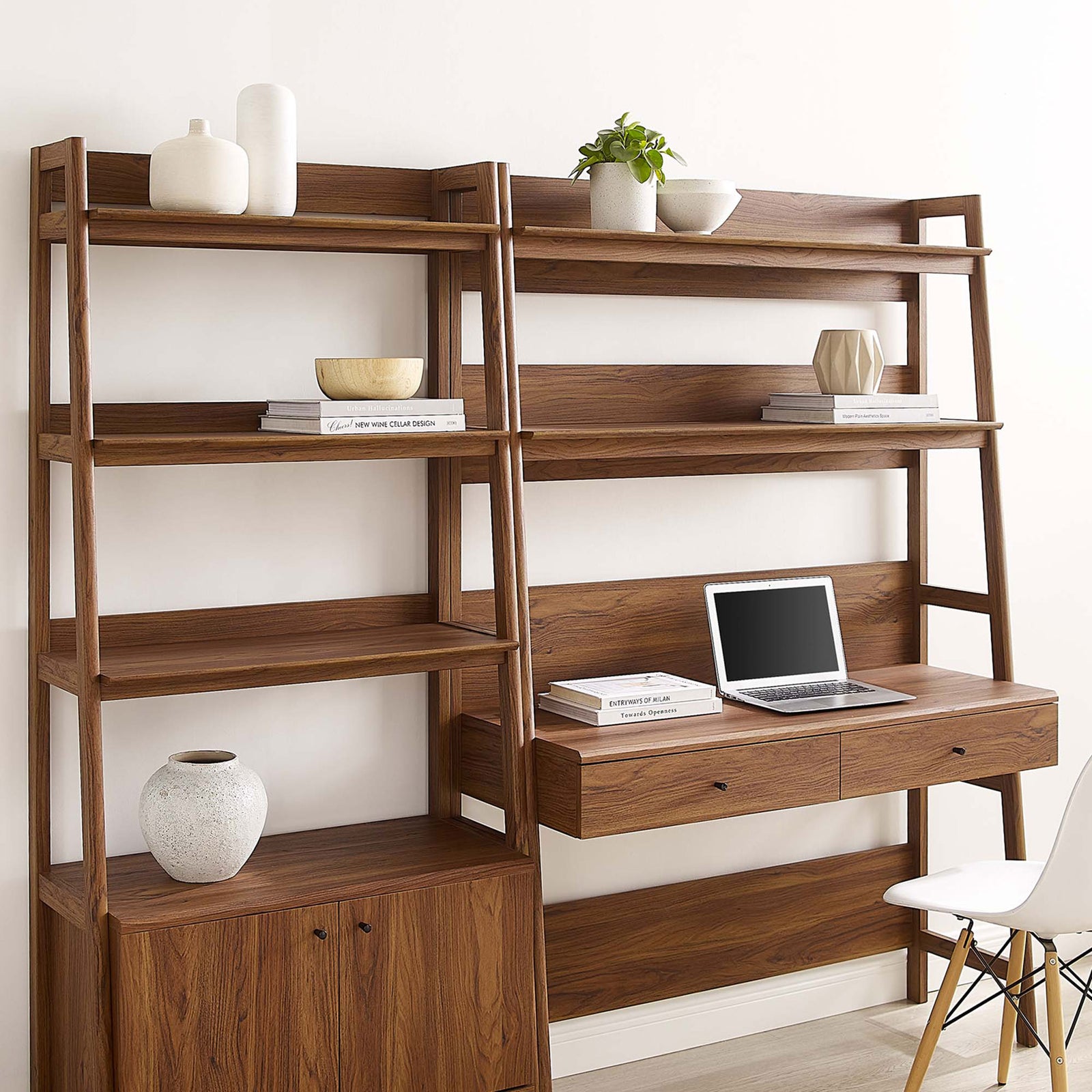Warm walnut finish adds texture to the ladder-style desk and bookshelf with ample shelving for display. || EEI-6112-WAL || front_angle_room