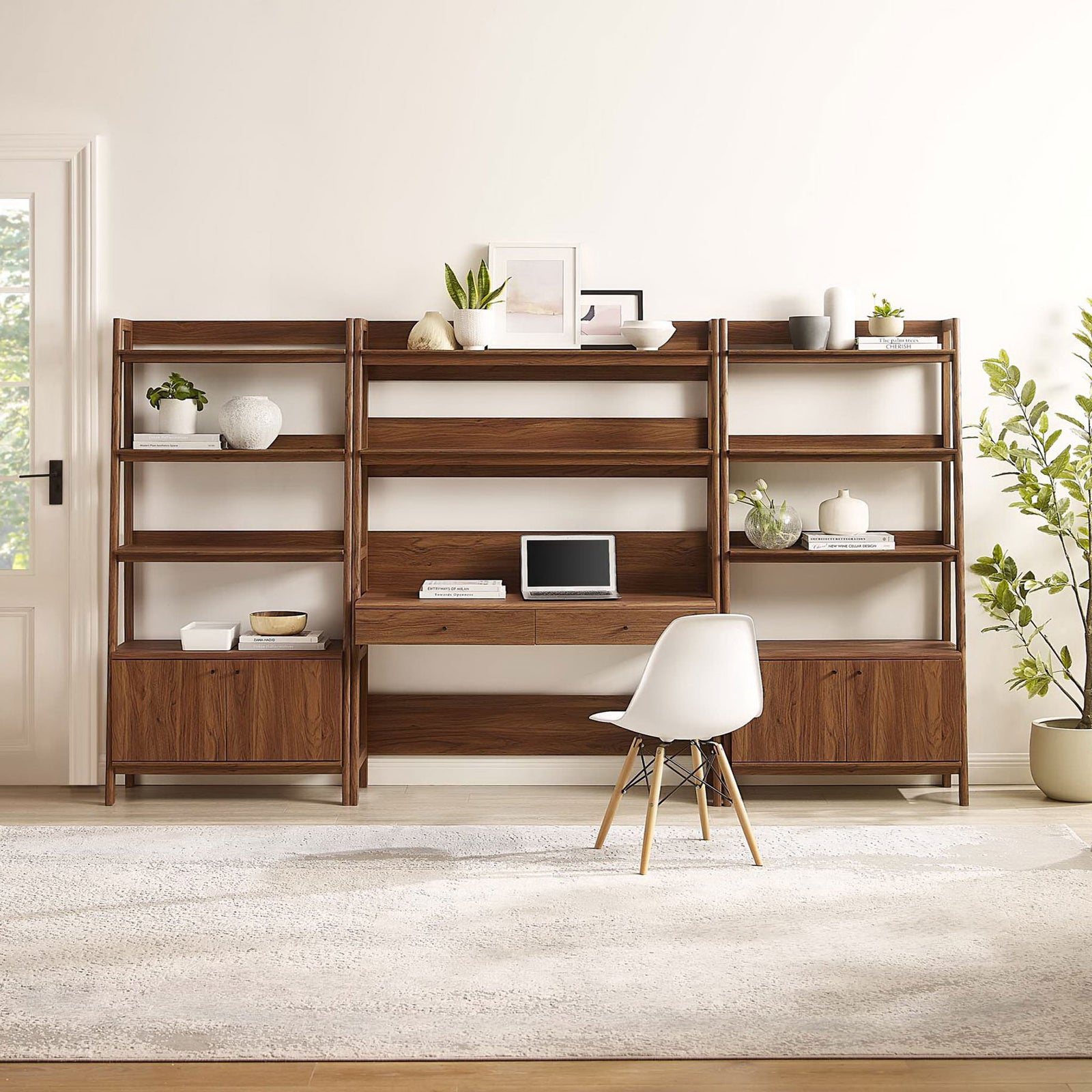 Expansive wall unit offers generous shelving, a spacious writing desk, and clean walnut wood grain || EEI-6115-WAL || front_room