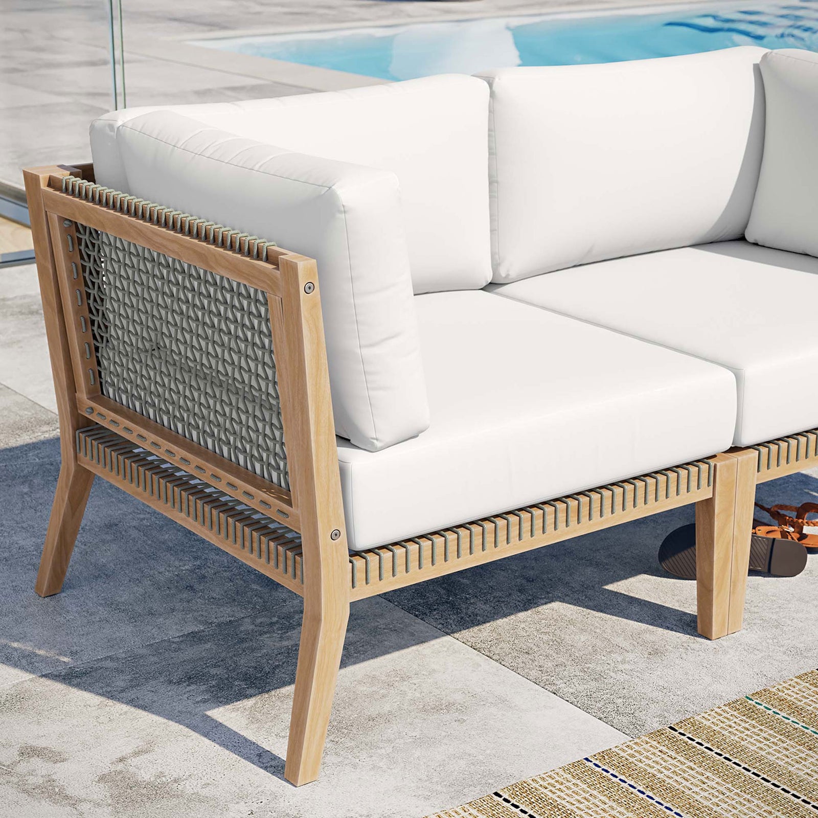 Poolside detail of teak frame, woven rope, and white cushions on the Clearwater loveseat || EEI-6119-GRY-WHI || detail_room