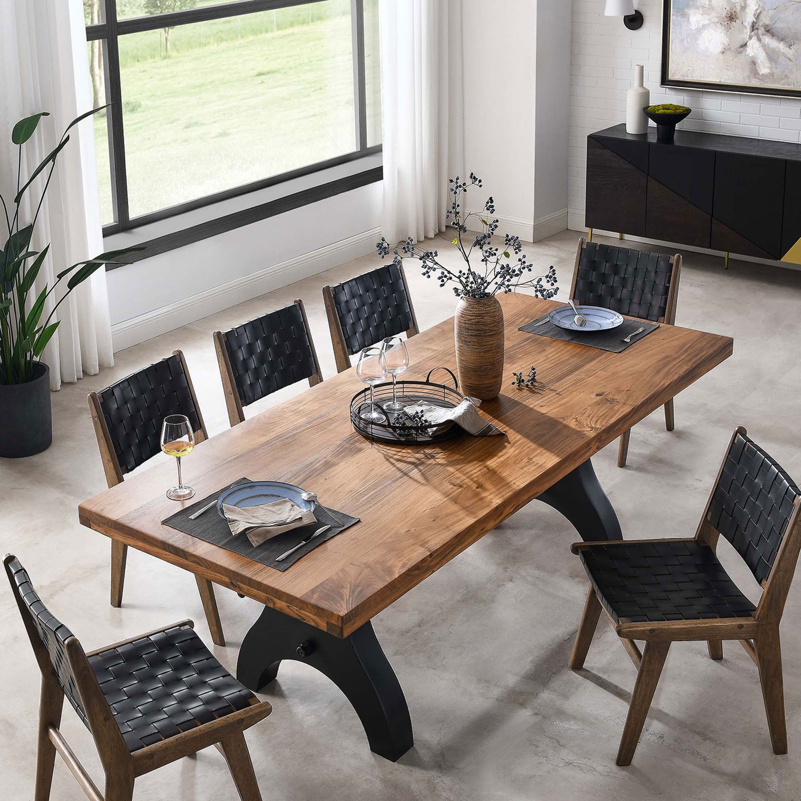 Genuine dining table set for guests with plates, glasses, and decor highlighting the spacious wood surface || EEI-6149-BLK-NAT || top_angle_room