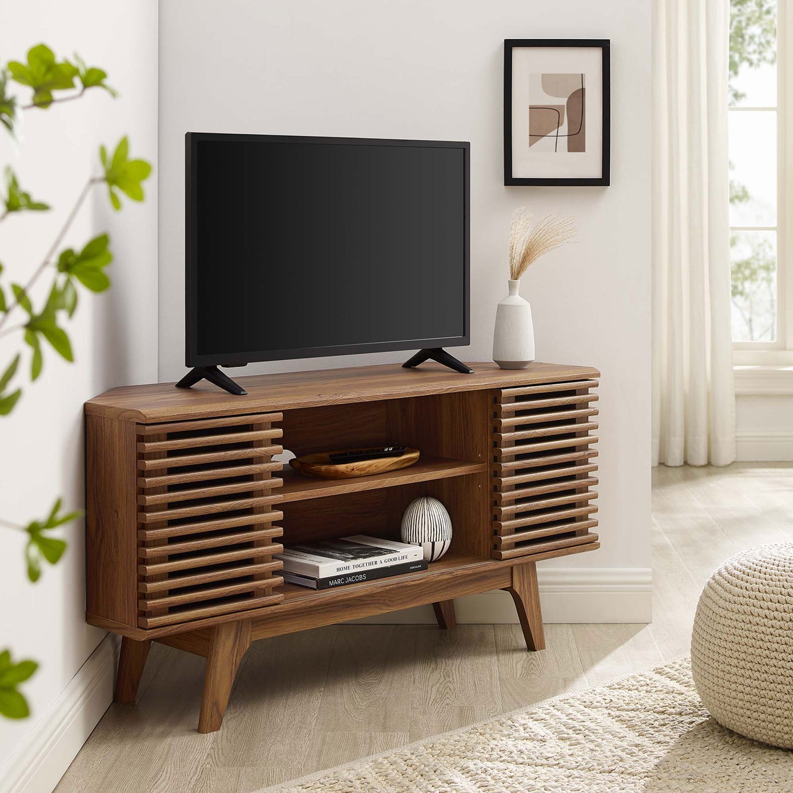 Walnut corner TV stand with TV and decor anchors a cozy mid-century inspired living room || EEI-6157-WAL || front_angle_room