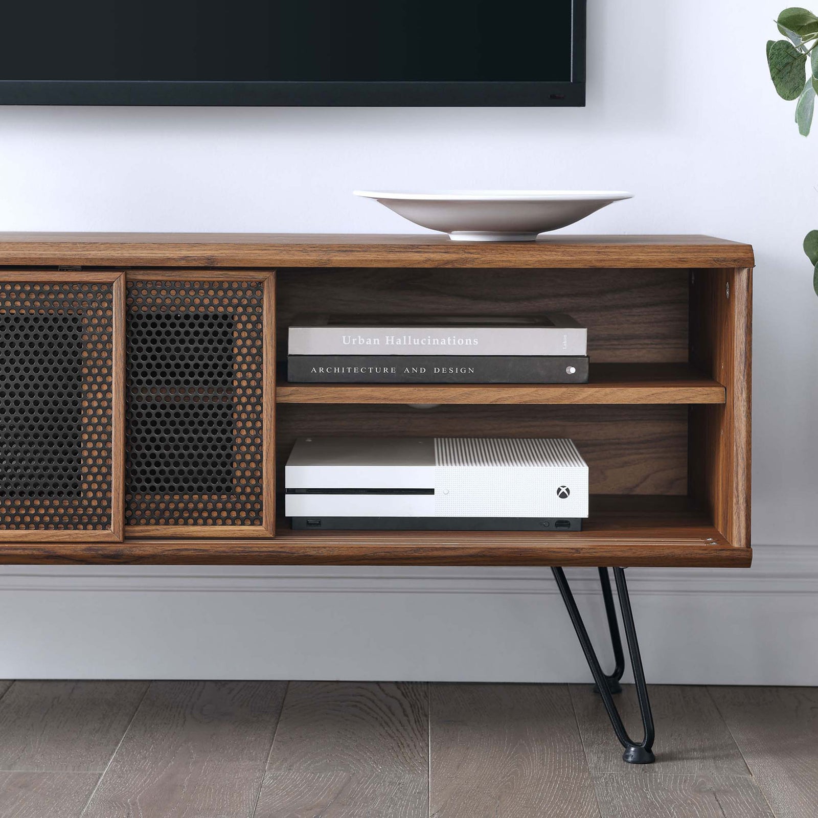Walnut TV stand styled in a living room, showing open shelves for consoles and books beside the mesh doors || EEI-6202-WAL || storage_room