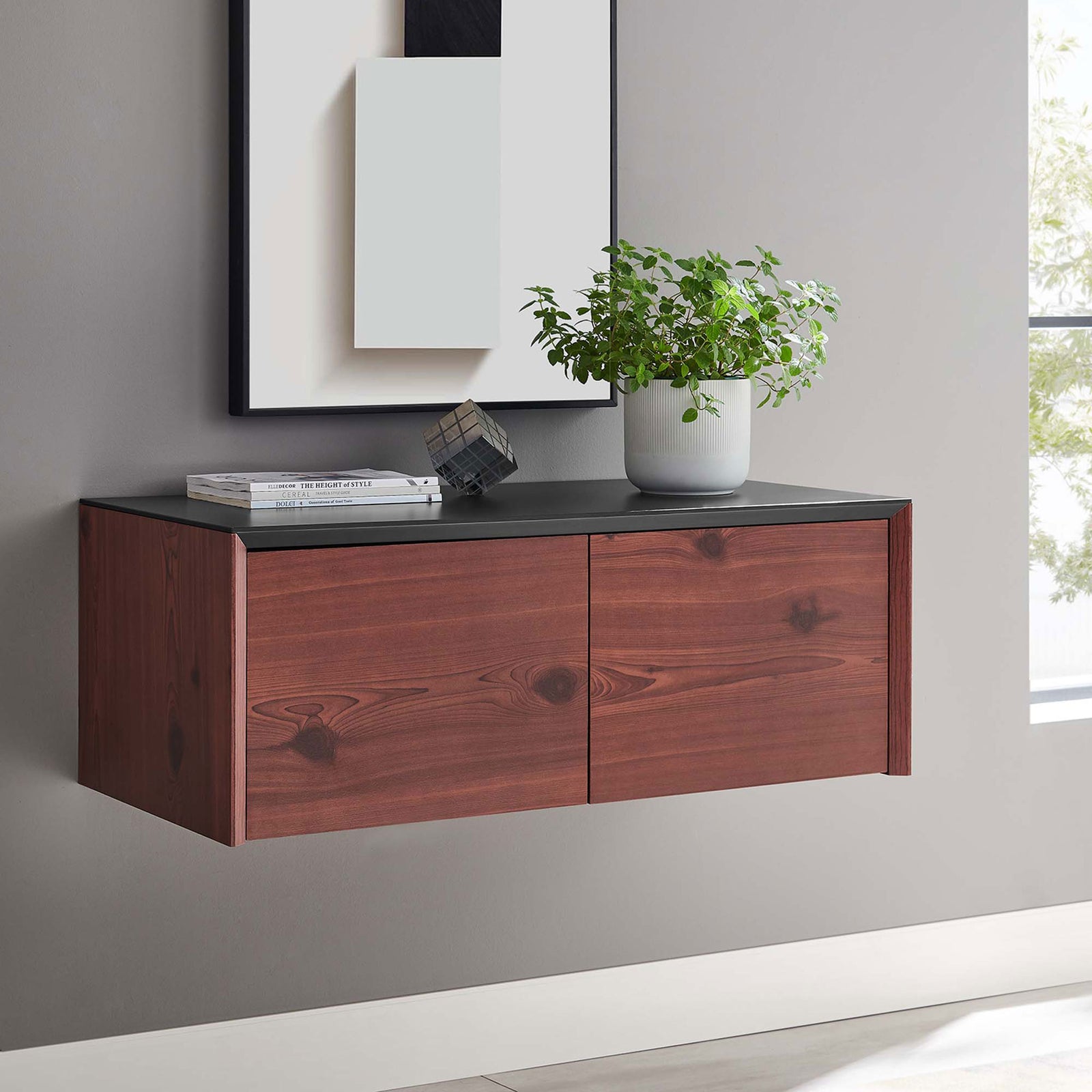Black cherry wall cabinet floating in a modern room with decor on top || EEI-6205-BLK-CHE || front_angle_room