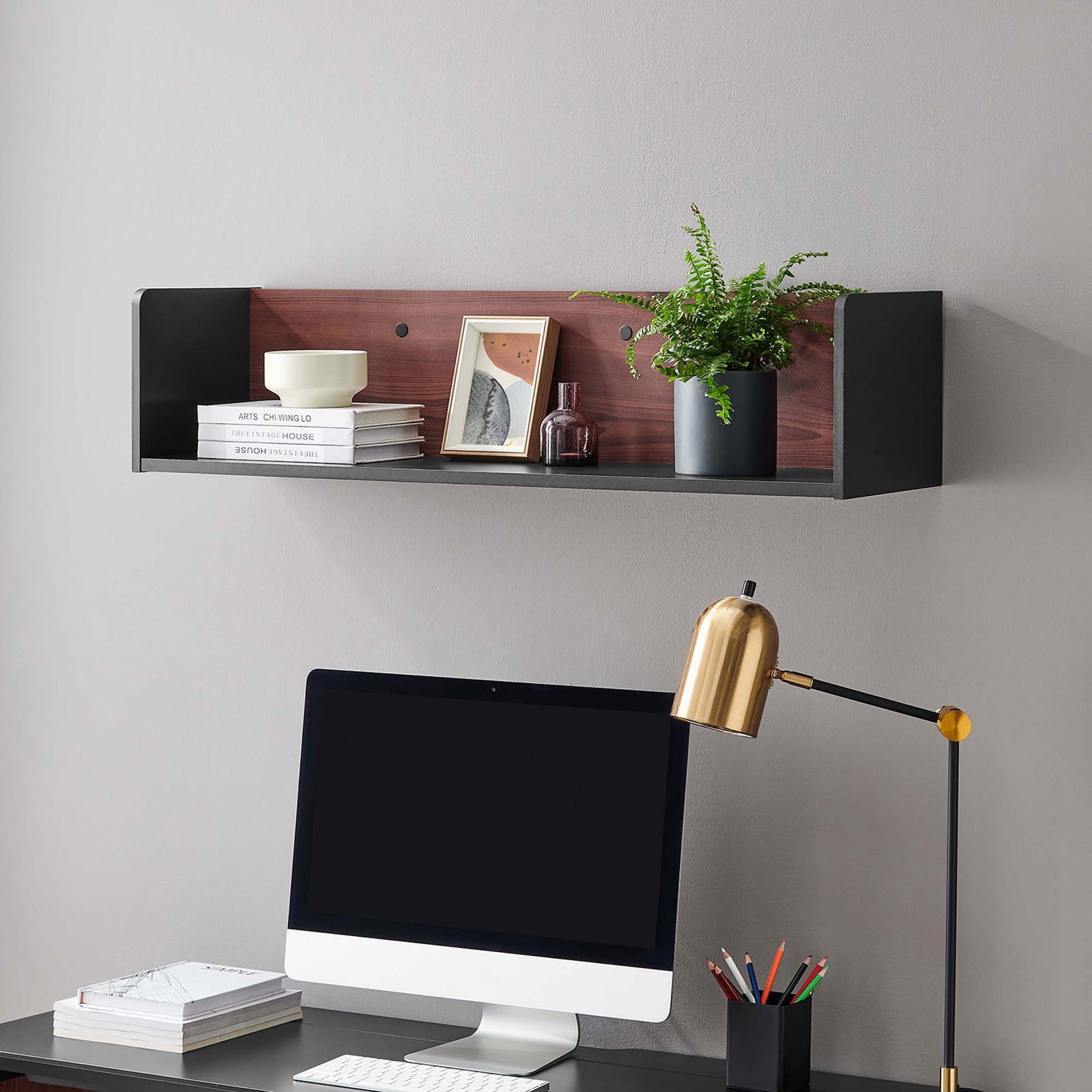 Black cherry wall shelf mounted above a desk, styled with books, decor, and greenery in a modern workspace. || EEI-6208-BLK-CHE || front_angle_room