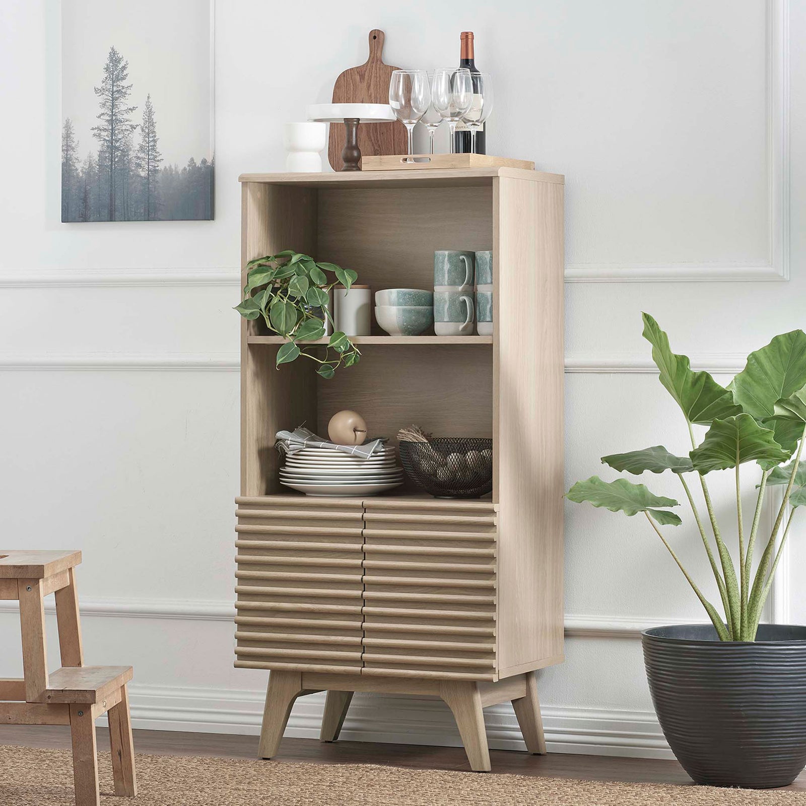 Elevates the room with mid-century charm and open shelves for dishes, plants, and decor || EEI-6229-OAK || front_angle_room