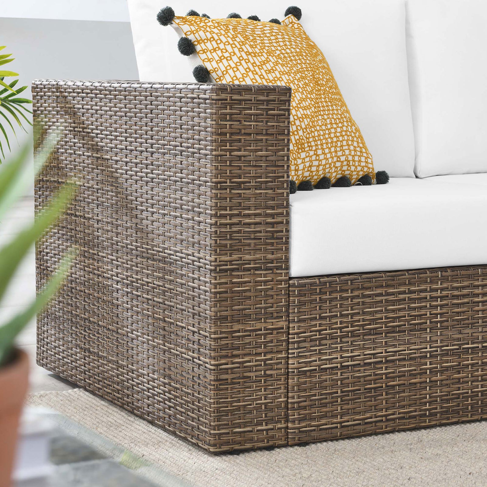 Textured cappuccino wicker arm and white cushion pair with a patterned pillow for a cozy patio accent || EEI-6246-CAP-WHI || detail_room