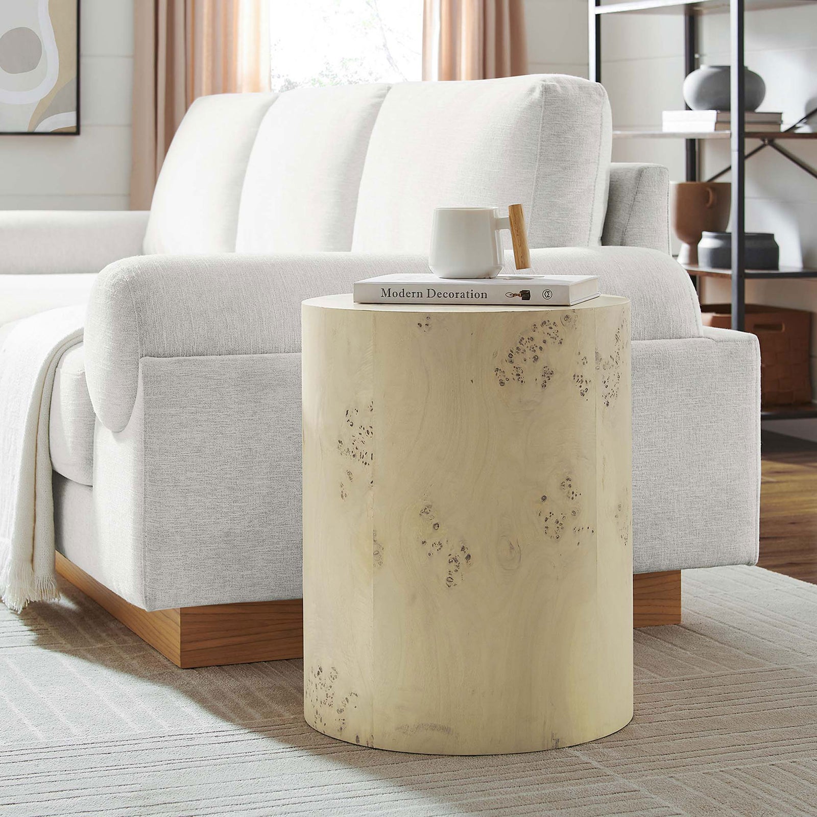 Bleached burl round side table styled next to a modern sofa, adding warm organic texture to the room || EEI-6271-BLB || front_angle_room