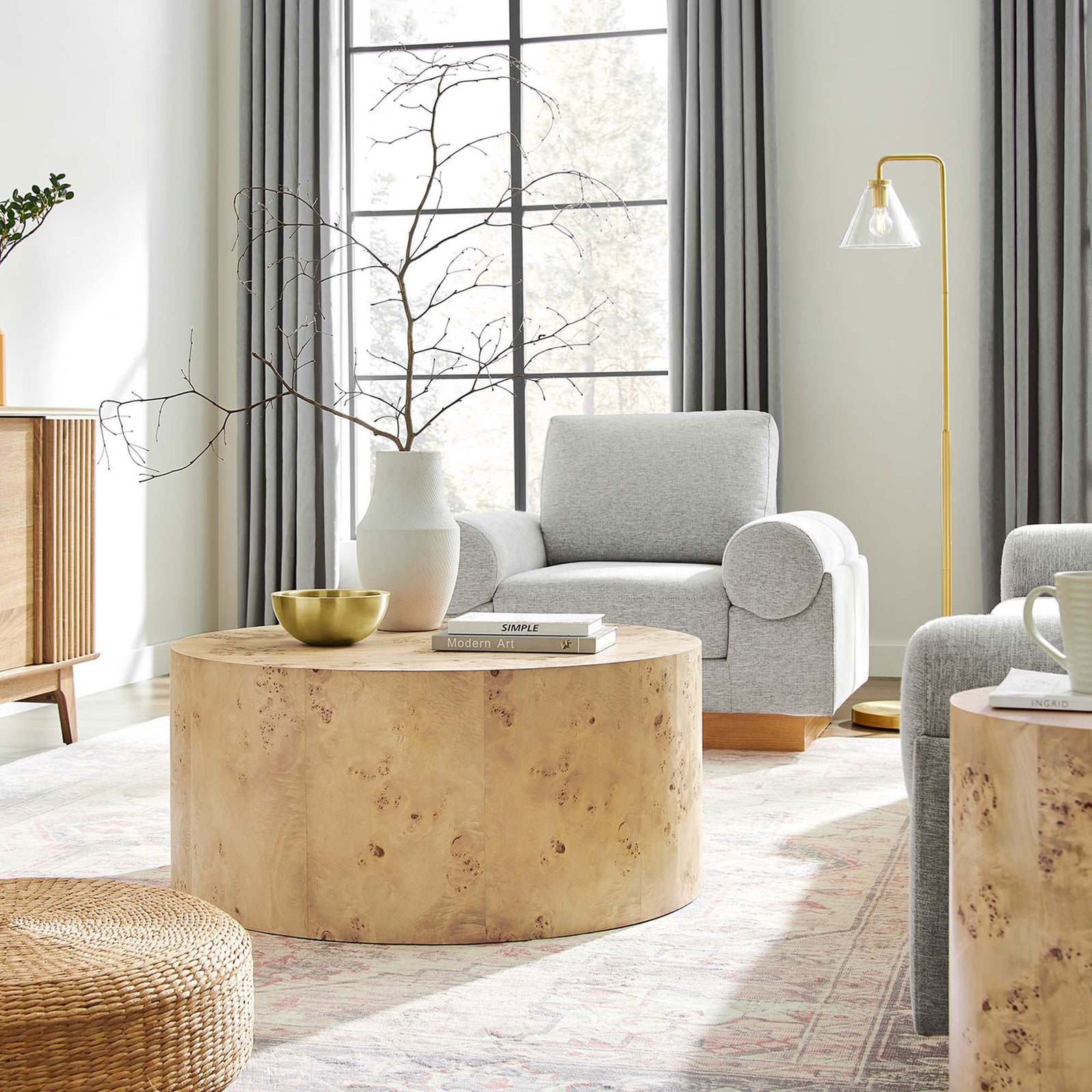 Modern drum coffee table anchors the room with its clean lines and organic burl wood character. || EEI-6274-NAB || front_angle_room