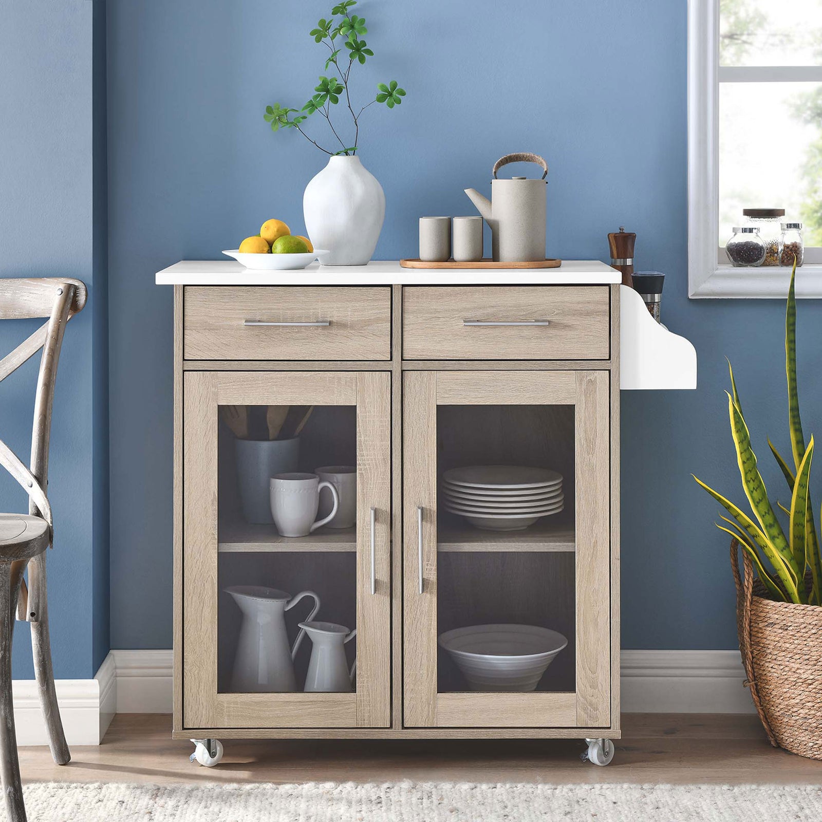 Oak and white kitchen cart styled in a bright dining nook with dishes, greenery, and serveware on display || EEI-6276-OAK-WHI || front_room