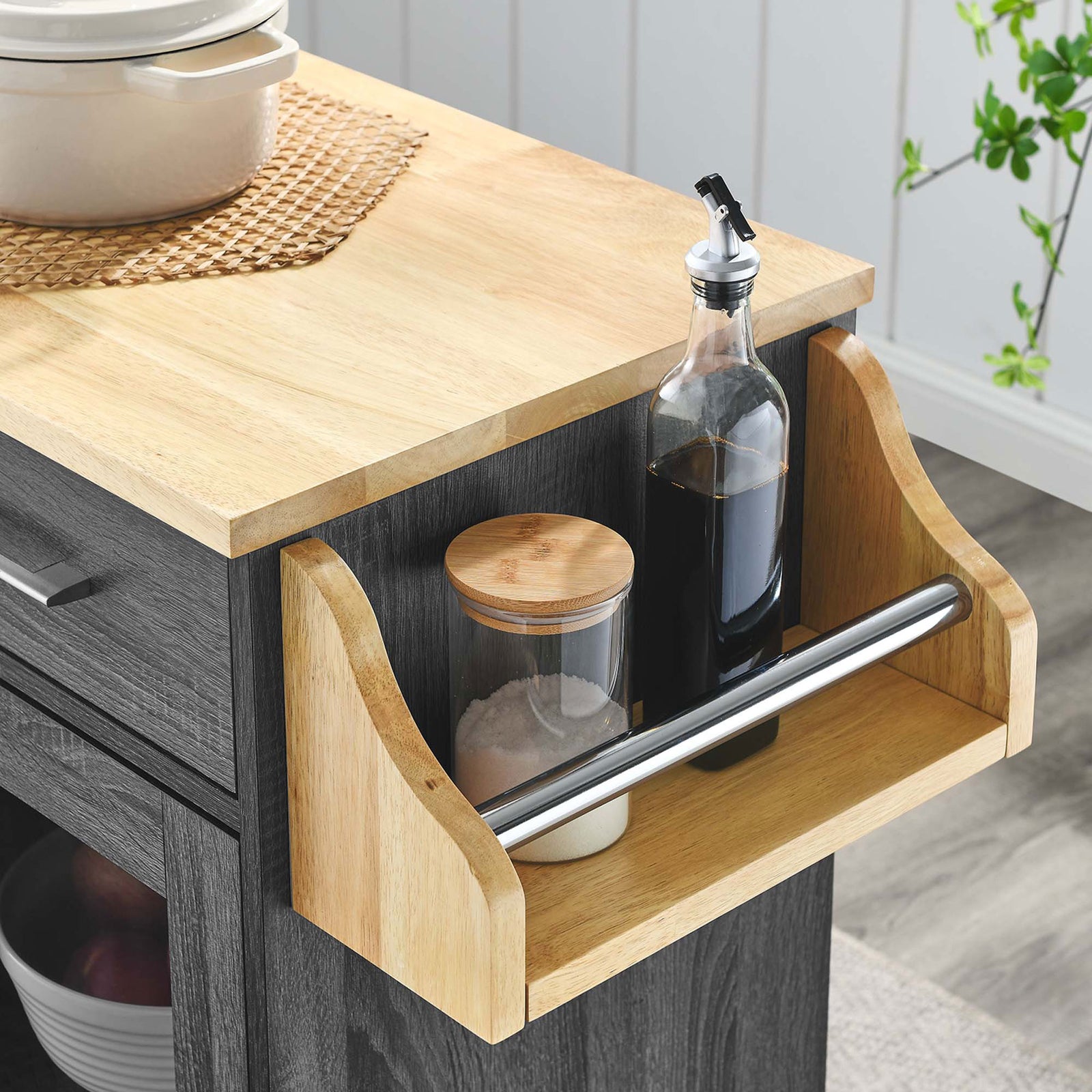 Spice rack on kitchen cart styled with oils and seasonings in a bright modern kitchen || EEI-6277-CHA-NAT || detail_room