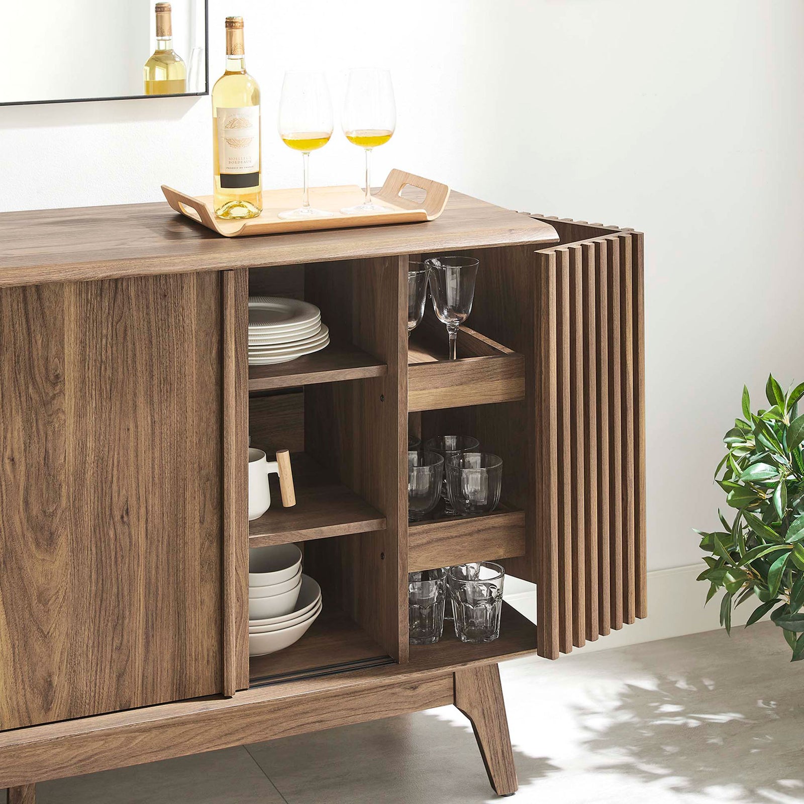 Open shelves and door racks neatly hold dinnerware and glassware, showcasing generous storage capacity. || EEI-6278-WAL || storage_open_room